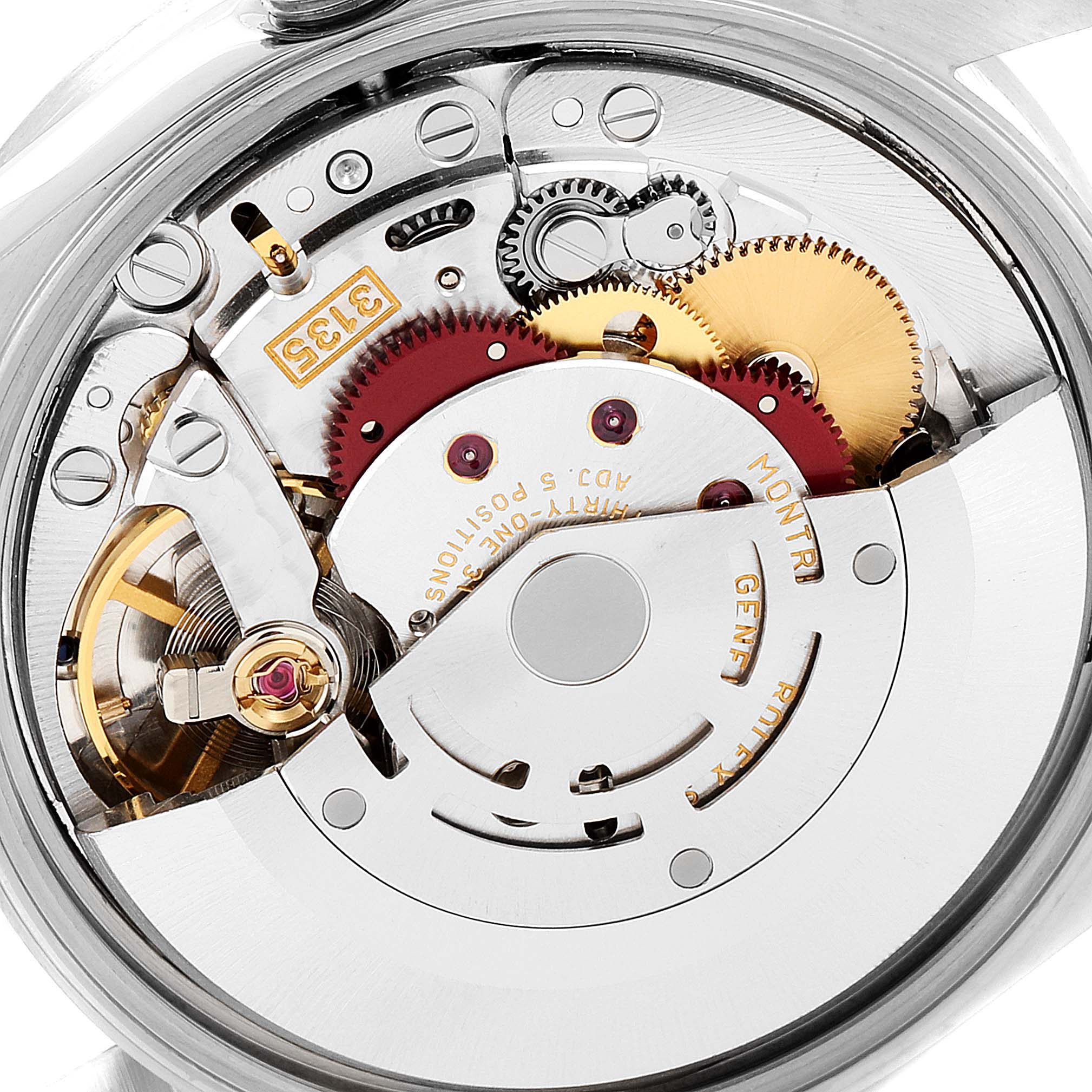 The image displays the internal mechanical movement of the Rolex Date 15210 Men's Stainless Steel Blue Dial 15210 Men's Stainless Steel Blue Dial model watch, focusing on its intricate gears and parts.