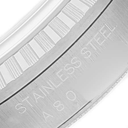 This image shows a close-up of the inner bezel and engraving of a Rolex Datejust 16220 Men's Stainless Steel Blue Dial 16220 Men's Stainless Steel Blue Dial watch, indicating "STAINLESS STEEL."