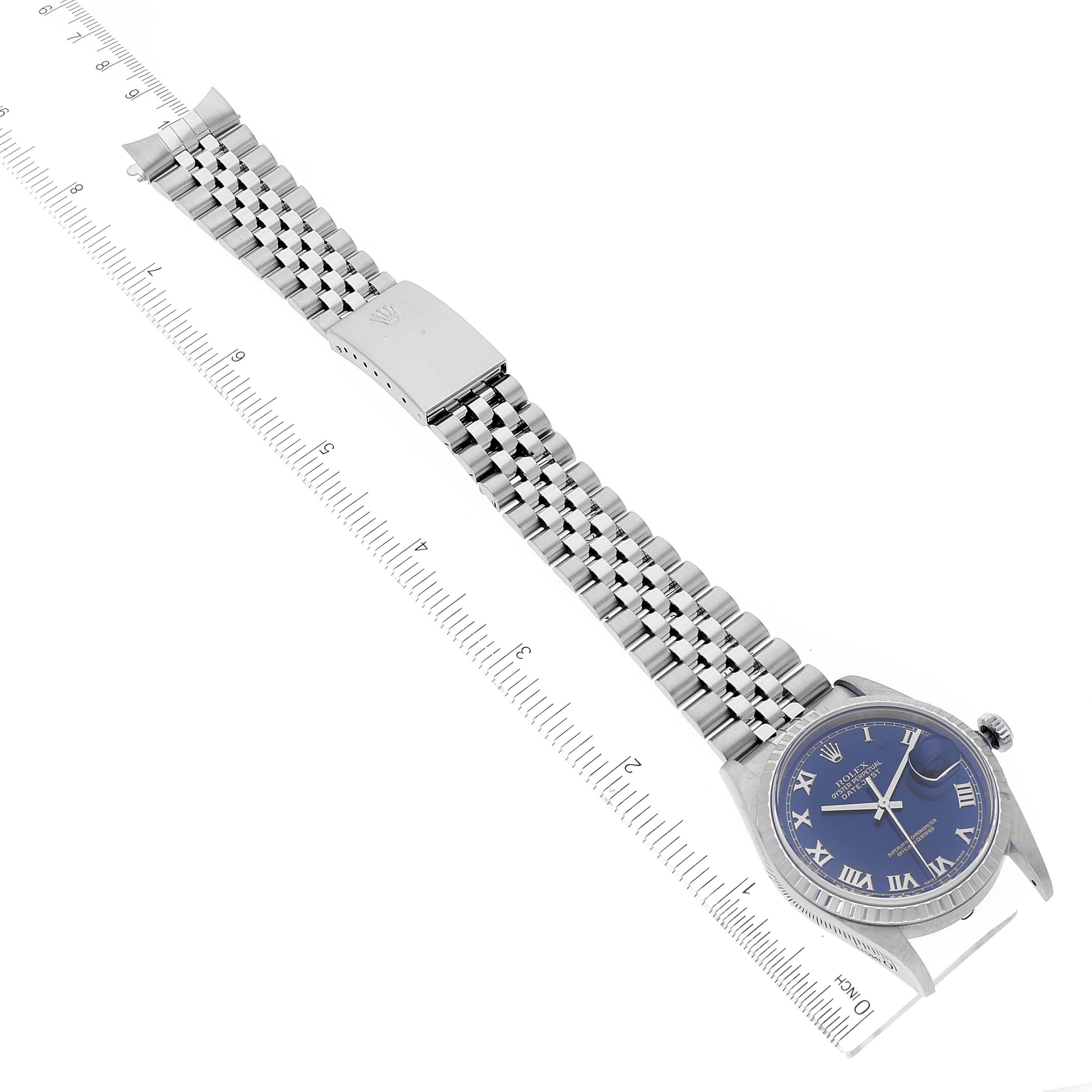 This image shows a full view of a Rolex Datejust 16220 Men's Stainless Steel Blue Dial 16220 Men's Stainless Steel Blue Dial watch laid flat, highlighting the blue dial, bracelet, and clasp at a slight angle.