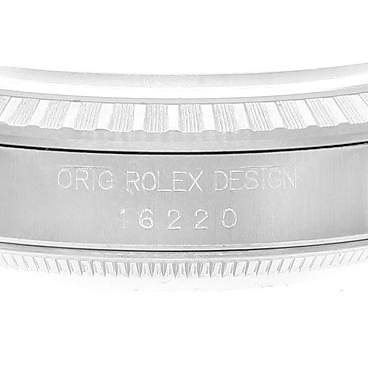 This image shows a close-up of the edge and engraved model number (16220) on the case of a Rolex Datejust 16220 Men's Stainless Steel Blue Dial 16220 Men's Stainless Steel Blue Dial watch.
