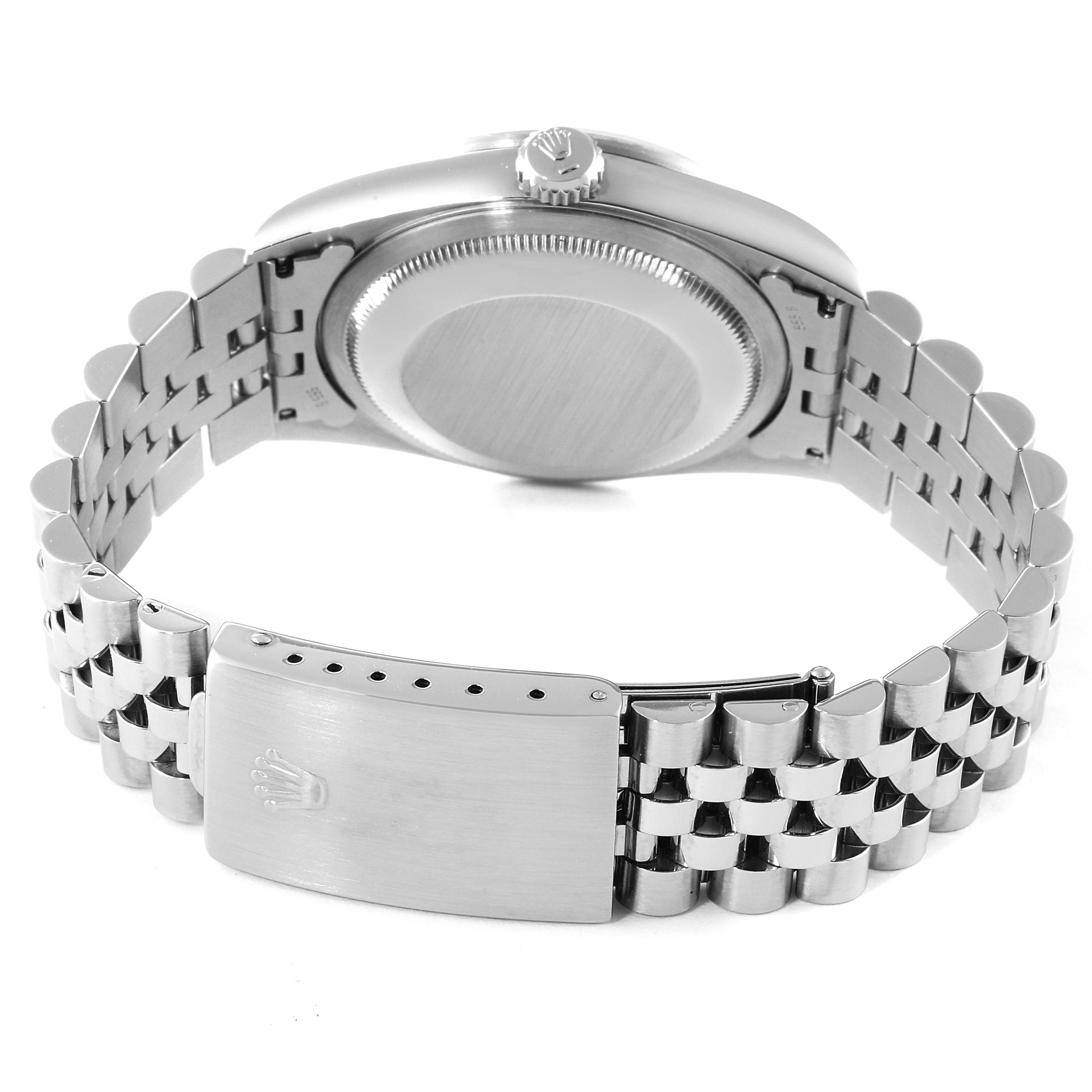 This image shows the back case, crown, and bracelet of the Rolex Datejust 16220 Men's Stainless Steel Blue Dial 16220 Men's Stainless Steel Blue Dial watch at an angle.