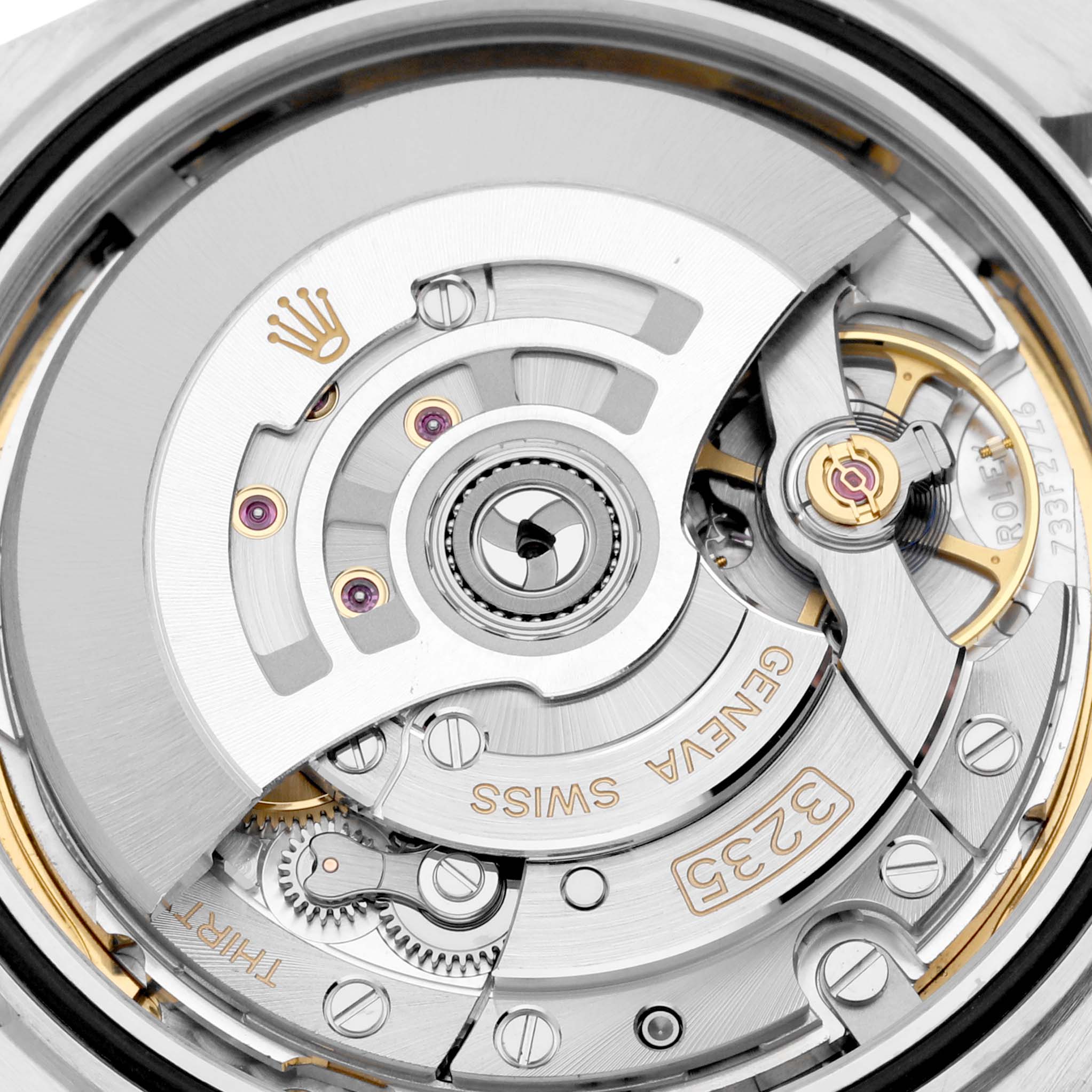 The image is a close-up of the movement mechanism of the Rolex Datejust 41 126334 Men
s Stainless Steel Mother of Pearl Dial 126334 Men
s Stainless Steel Mother of Pearl Dial watch, showcasing intricate gears and components.