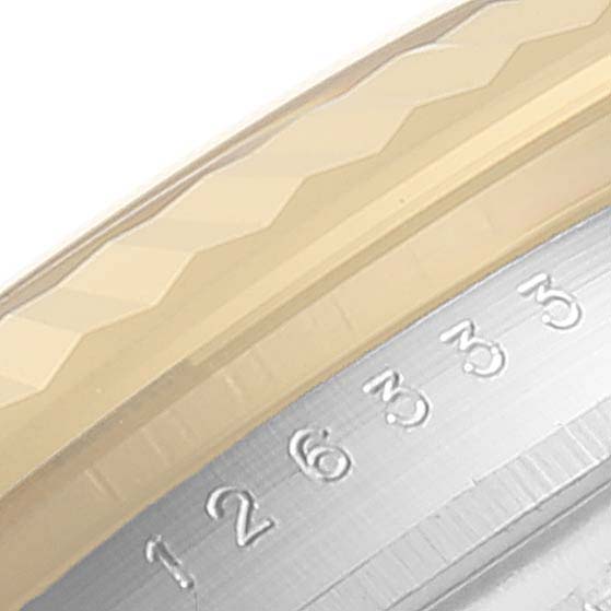The image shows a close-up of the fluted bezel and part of the rehaut with engraved numbers of the Rolex Datejust 41 126333 Men's Steel and Gold (two tone) Grey Dial 126333 Men's Steel and Gold (two tone) Grey Dial model.