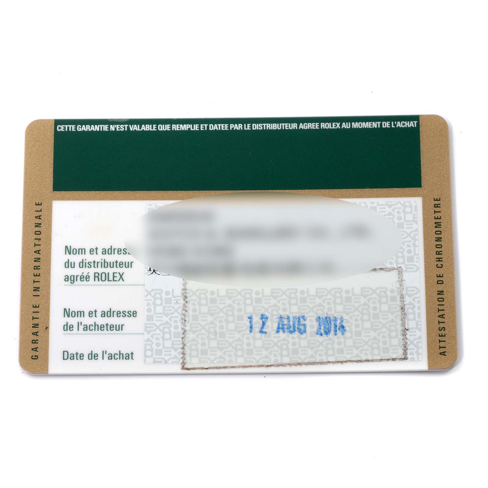 This image shows a warranty card for a Mid-Size Rolex watch, viewed from a top-down angle.