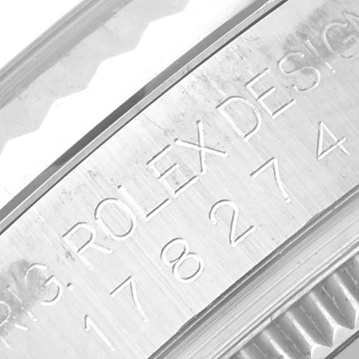 Close-up of the engraving on the edge of a Rolex Mid-Size 178274 Women
s Stainless Steel Silver Dial 178274 Women
s Stainless Steel Silver Dial model watch, displaying the brand and model number.