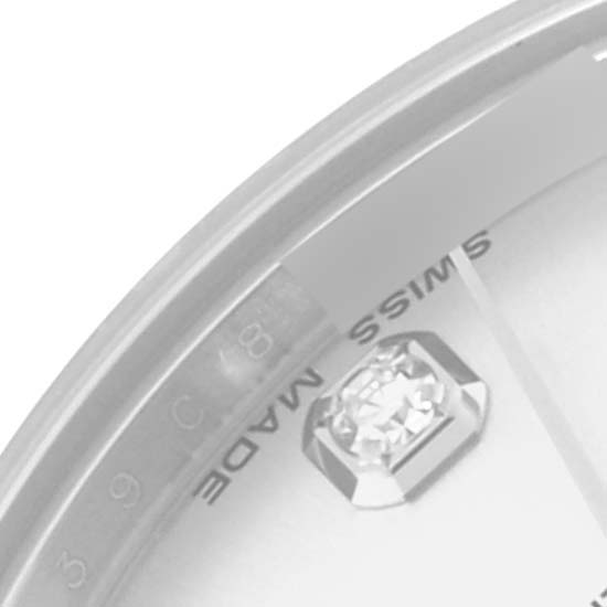 The image shows a close-up of the Rolex Mid-Size 178274 Women
s Stainless Steel Silver Dial 178274 Women
s Stainless Steel Silver Dial watch face, focusing on the diamond marker and the "Swiss Made" text.