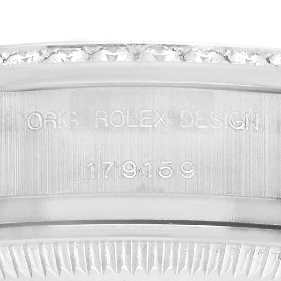 The image shows a close-up of the bezel engraving on a Rolex President 179159 Women
s Platinum Blue Dial 179159 Women
s Platinum Blue Dial watch, featuring the model number and diamond details.