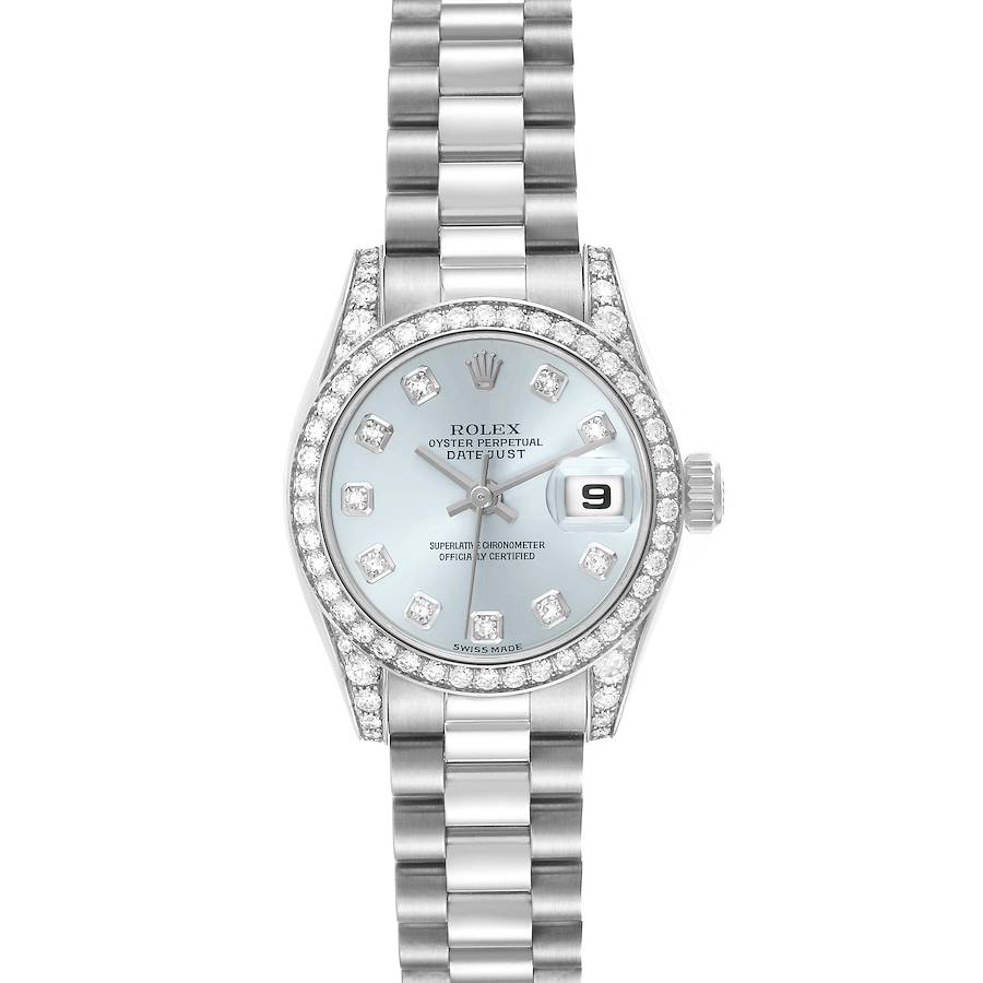 The Rolex President model watch is shown from a top-down angle, highlighting its diamond bezel, dial, and bracelet.
