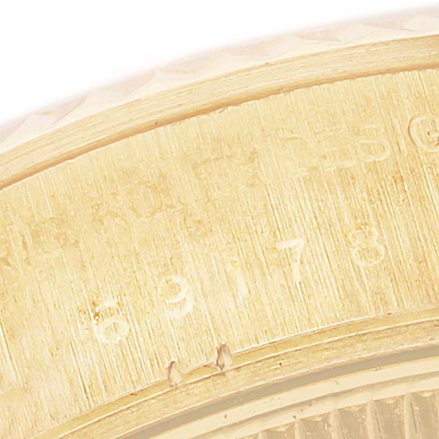 This close-up image shows the engraved serial number area on the gold casing of a Rolex President 69178 Women
s Yellow Gold Champagne Dial 69178 Women
s Yellow Gold Champagne Dial model watch.