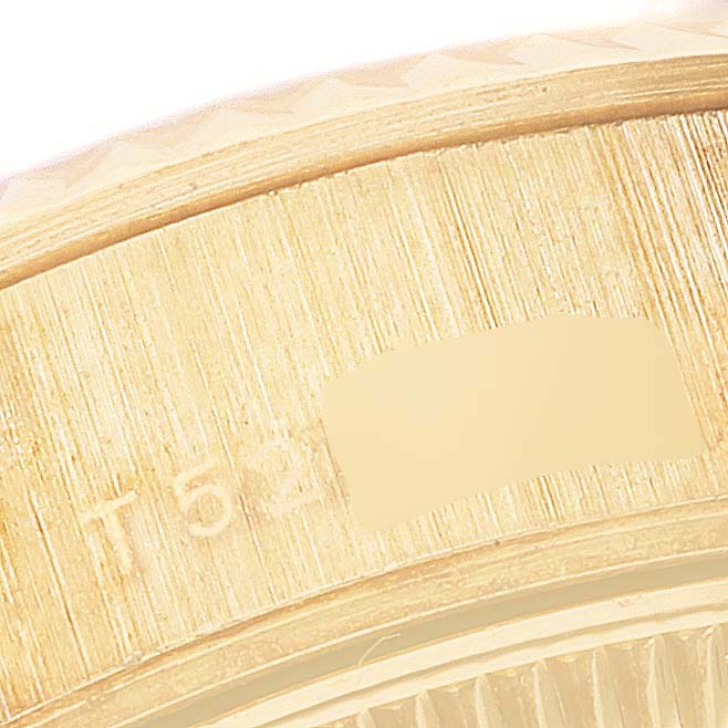 This is a close-up view of the side of the case of the Rolex President 69178 Women
s Yellow Gold Champagne Dial 69178 Women
s Yellow Gold Champagne Dial model, showing part of its serial number.