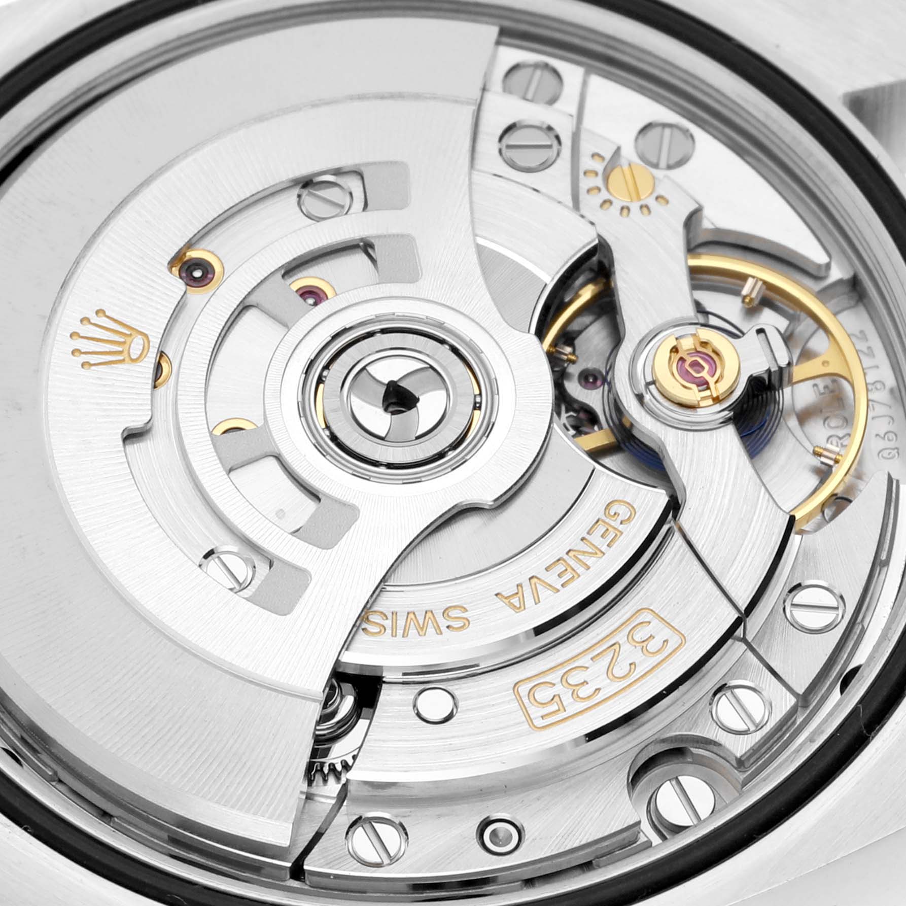 The image shows a close-up of the movement and rotor of the Rolex Datejust 126284 Men's Stainless Steel Blue Dial 126284 Men's Stainless Steel Blue Dial watch.