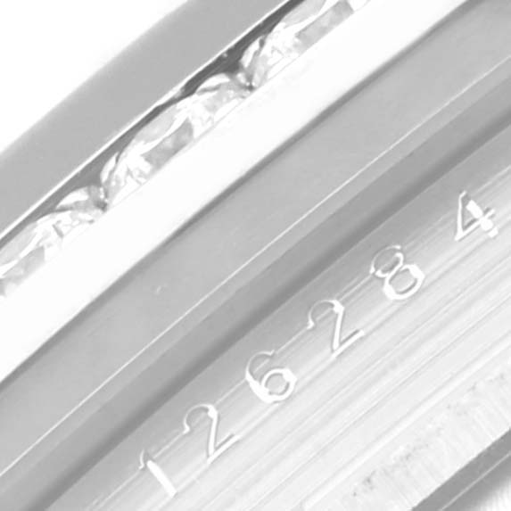 The image shows a close-up of the serial number on the case back of a Rolex Datejust 126284 Men's Stainless Steel Blue Dial 126284 Men's Stainless Steel Blue Dial watch.