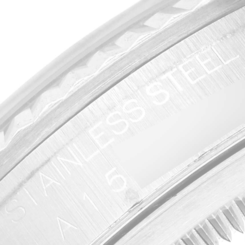 Close-up of the side view of the Rolex Datejust 16234 Men's Stainless Steel Black Dial 16234 Men's Stainless Steel Black Dial showing part of the bezel and stainless steel engraving.