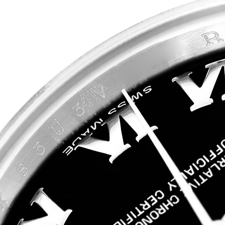The image shows a close-up of the Rolex Datejust 179174 Women
s Stainless Steel Black Dial 179174 Women
s Stainless Steel Black Dial dial and bezel edge, emphasizing the "Swiss Made" text and hour markers.