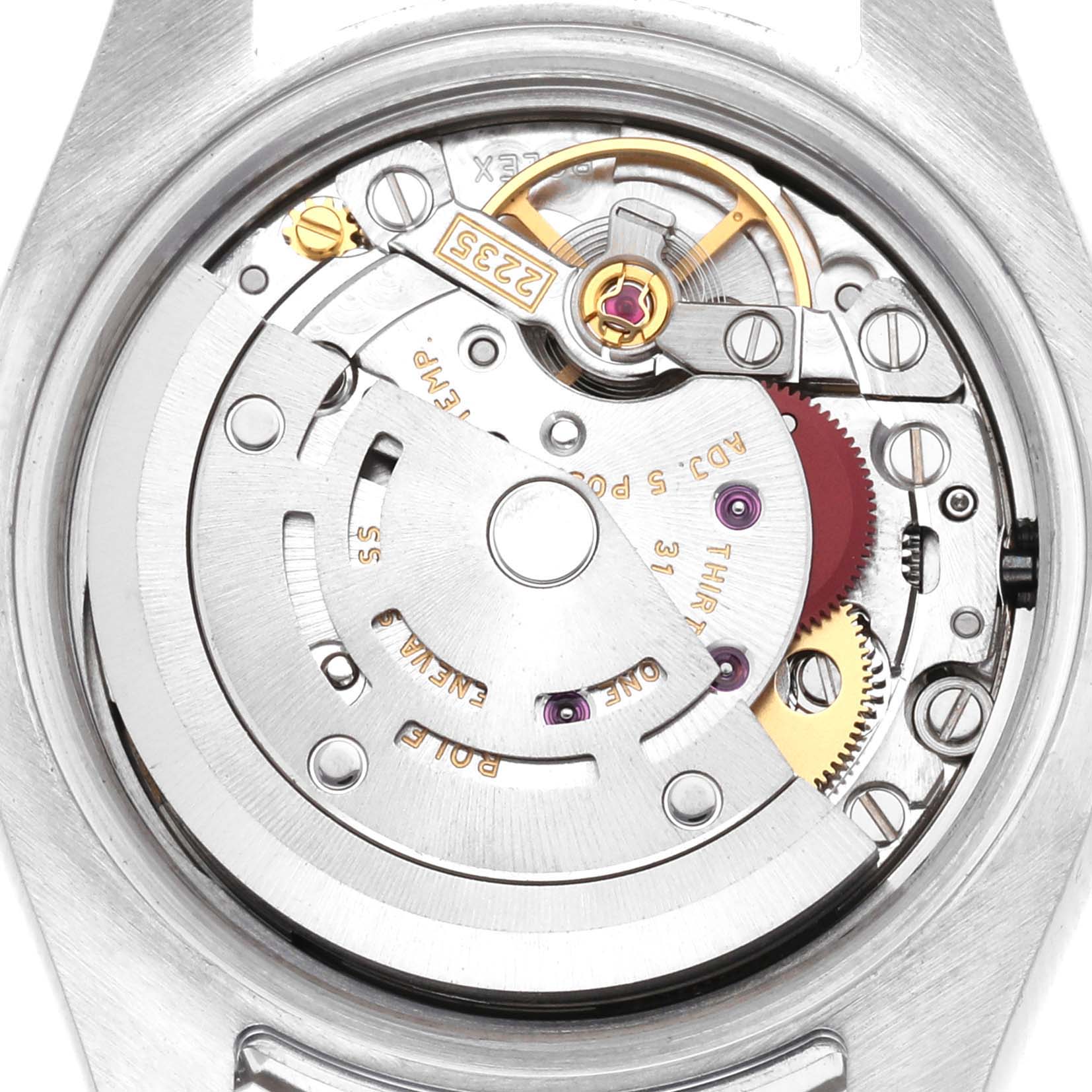 The image shows a close-up of the Rolex Datejust 179174 Women
s Stainless Steel Black Dial 179174 Women
s Stainless Steel Black Dial movement, highlighting the rotor and internal mechanisms from a back angle.