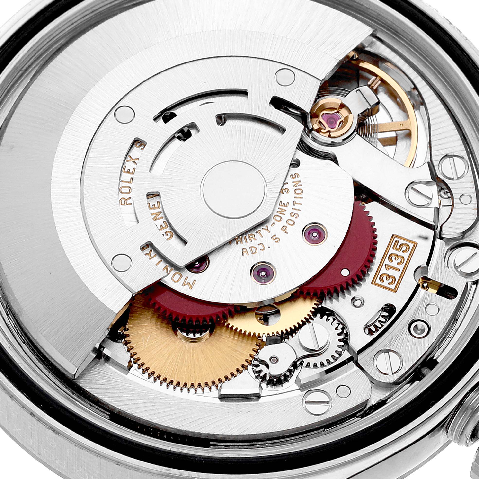 This close-up image of the Rolex Datejust 16234 Men's Stainless Steel Mother of Pearl Dial 16234 Men's Stainless Steel Mother of Pearl Dial watch shows the mechanical movement components and internal rotor.