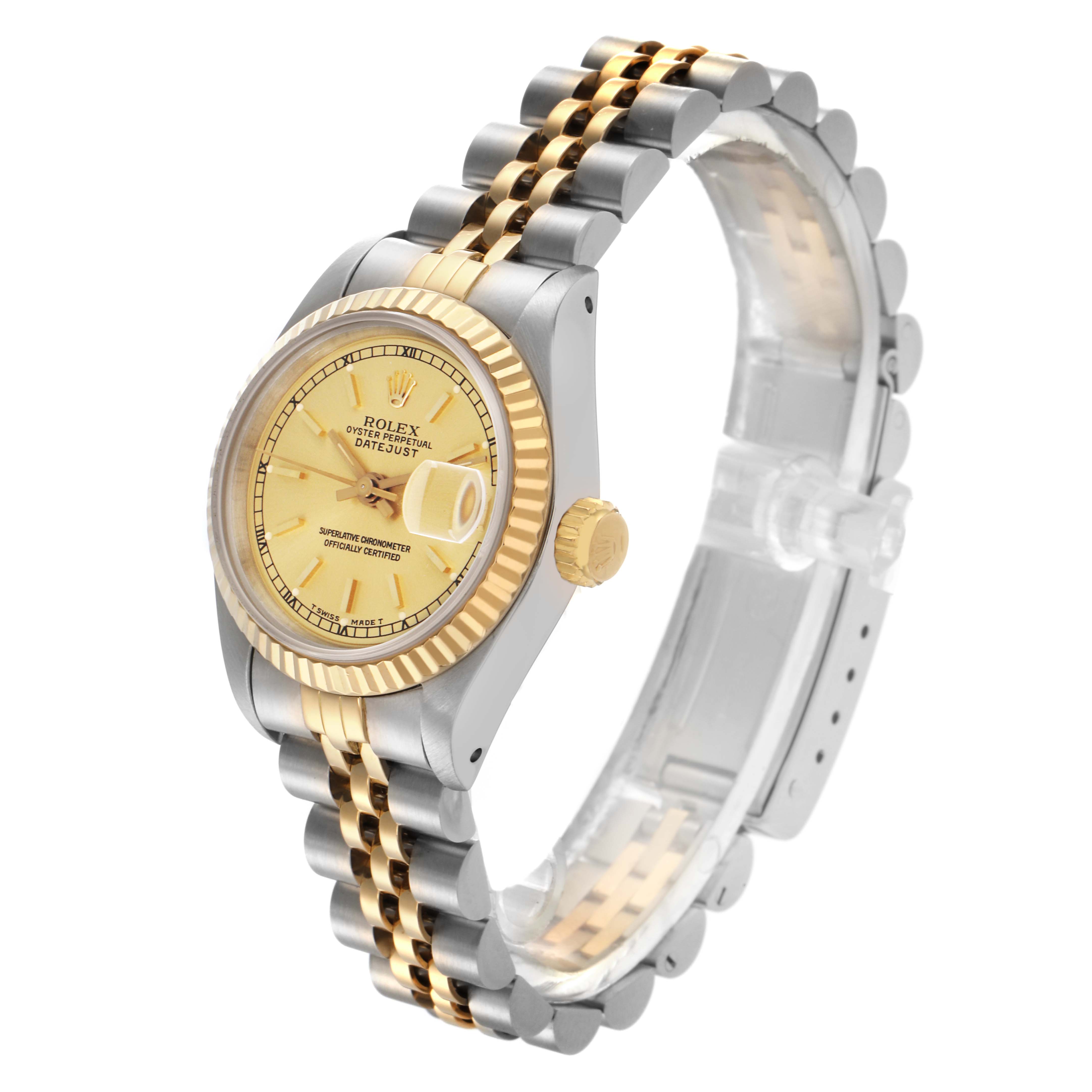 The Rolex Datejust 69173 Women
s Steel and Gold (two tone) Champagne Dial 69173 Women
s Steel and Gold (two tone) Champagne Dial watch is shown at a three-quarter angle, highlighting its yellow gold dial, fluted bezel, two-tone bracelet, and crown.