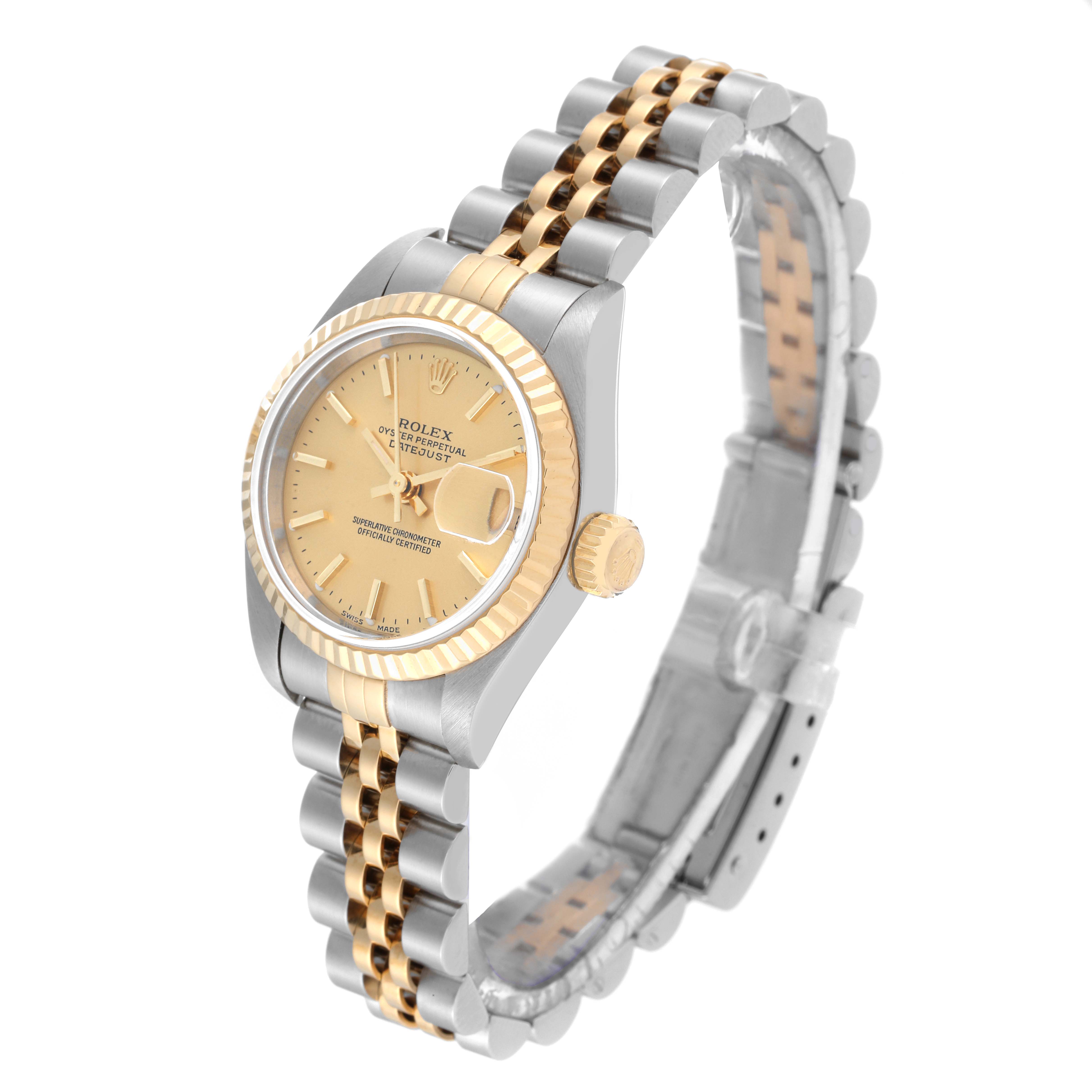 The image shows a Rolex Datejust 79173 Women's Steel and Gold (two tone) Champagne Dial 79173 Women's Steel and Gold (two tone) Champagne Dial watch at a three-quarter angle featuring a gold dial, fluted bezel, and two-tone Jubilee bracelet.