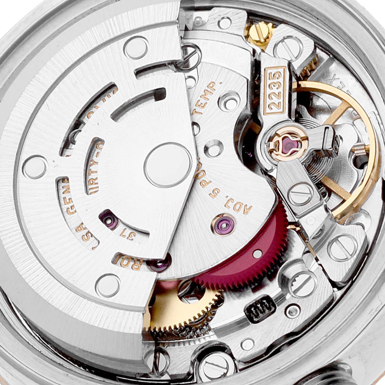 The image shows a detailed close-up of the inner workings of a Rolex Datejust 79173 Women's Steel and Gold (two tone) Champagne Dial 79173 Women's Steel and Gold (two tone) Champagne Dial watch movement, showcasing gears and components.