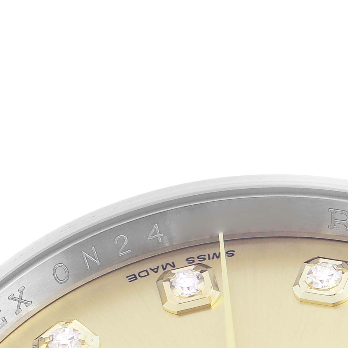 The image shows a close-up of the Rolex Datejust 116233 Men's Steel and Gold (two tone) Champagne Dial 116233 Men's Steel and Gold (two tone) Champagne Dial watch, focusing on the bezel, part of the dial, and diamond hour markers.