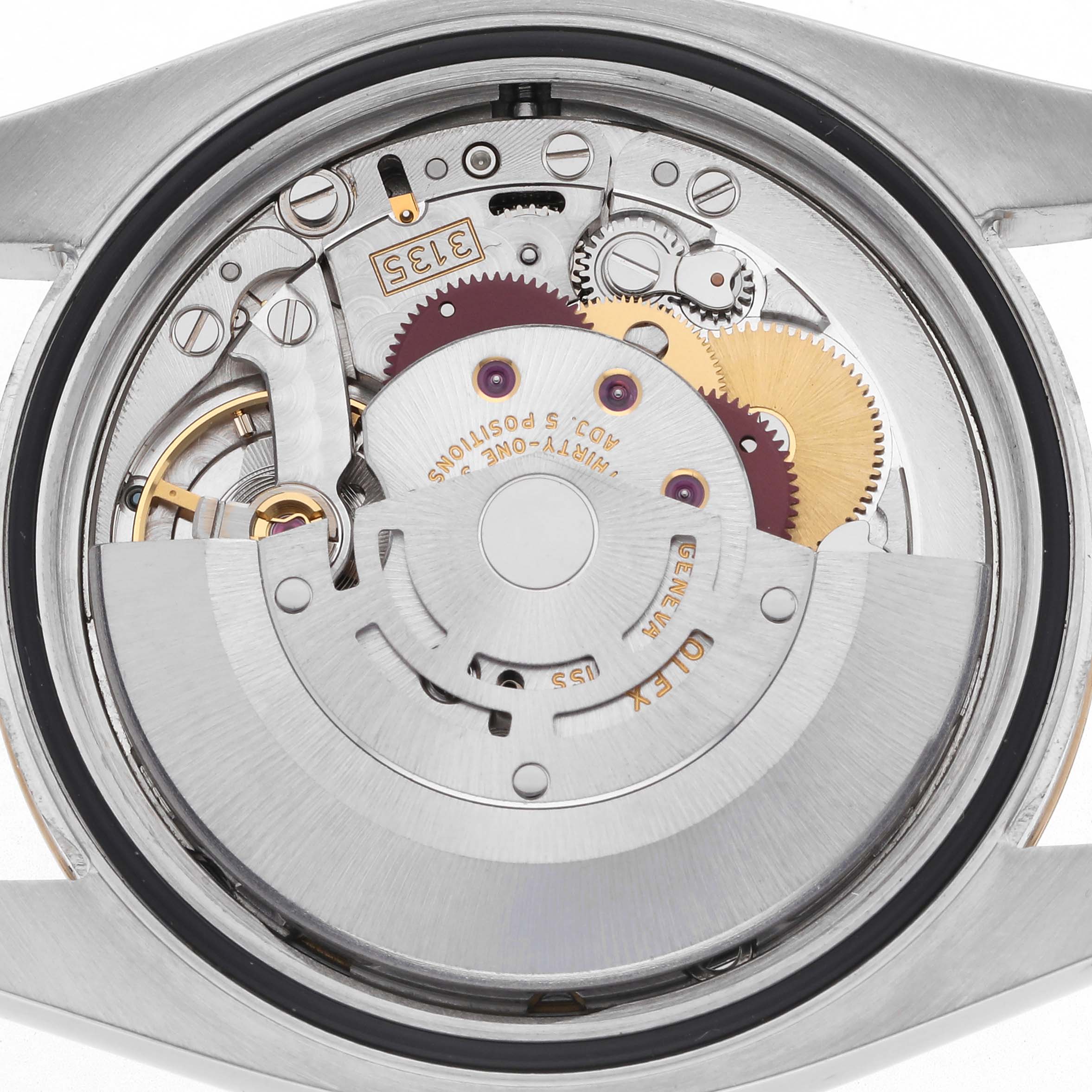 The image shows the movement of a Rolex Datejust 116233 Men's Steel and Gold (two tone) White Dial 116233 Men's Steel and Gold (two tone) White Dial watch from the back casing, highlighting gears and mechanisms.