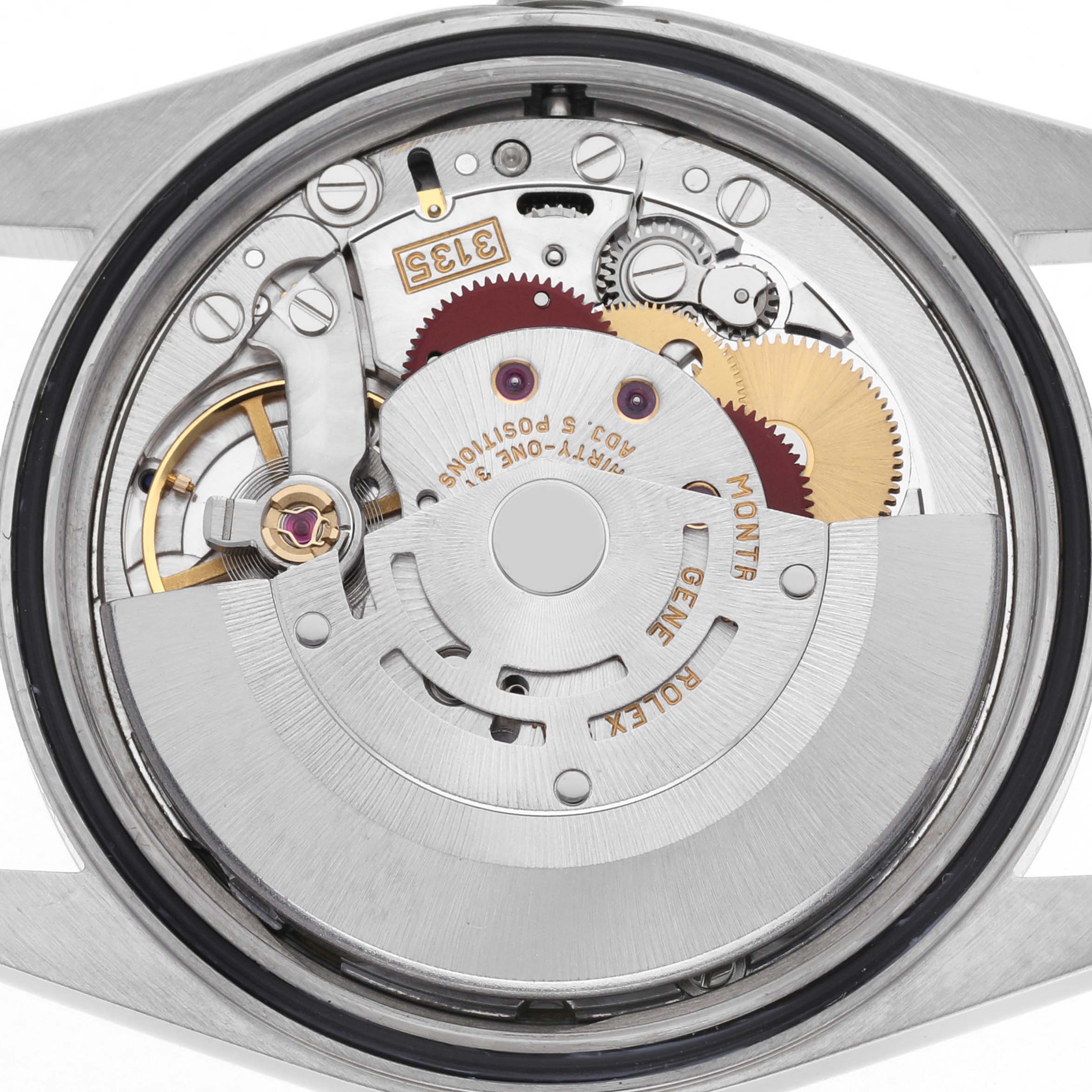The image shows a top-down view of the Rolex Datejust 16220 Men's Stainless Steel White Dial 16220 Men's Stainless Steel White Dial's movement, revealing intricate gears and the rotor.