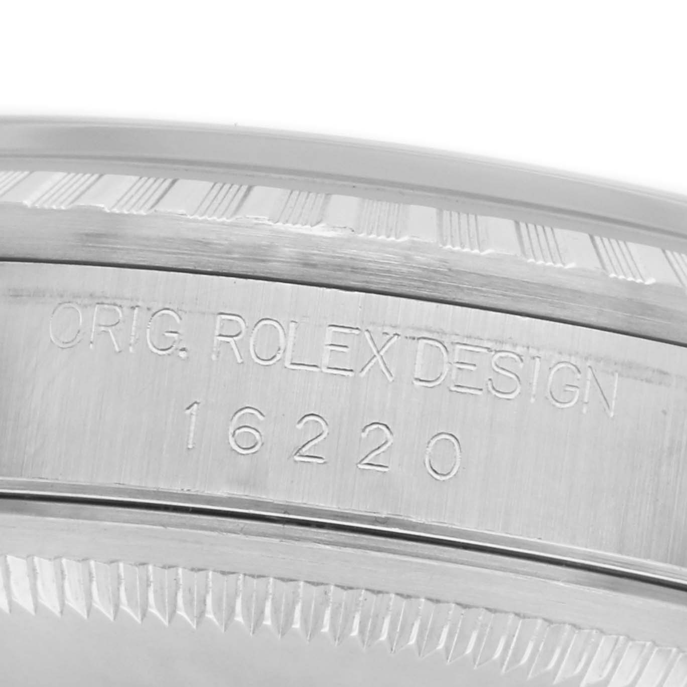 The image shows a close-up of the Rolex Datejust 16220 Men's Stainless Steel White Dial 16220 Men's Stainless Steel White Dial case side, highlighting the model number and engraving.