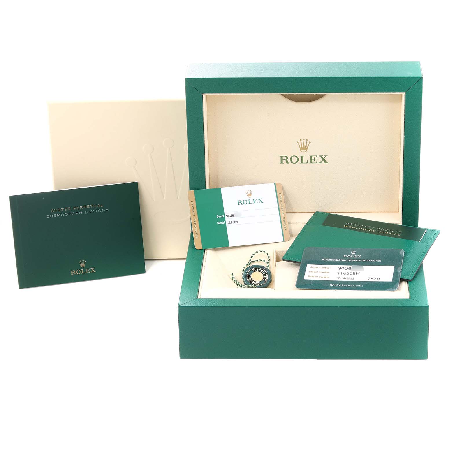 The image shows the Rolex Daytona 116509 Men's White Gold Blue Dial 116509 Men's White Gold Blue Dial watch packaging, warranty cards, tags, and manuals from a frontal angle.
