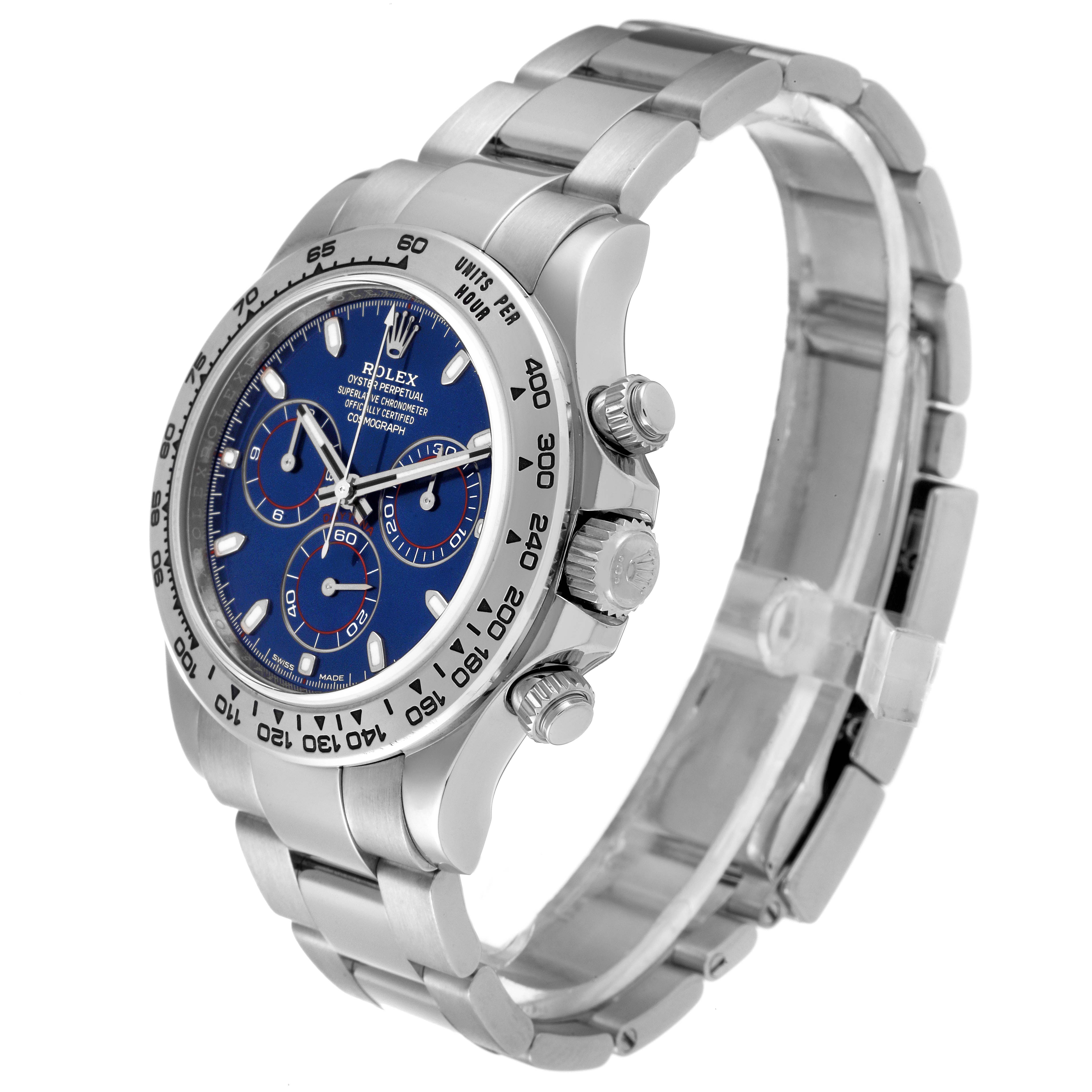 The image shows a side angle of a Rolex Daytona 116509 Men's White Gold Blue Dial 116509 Men's White Gold Blue Dial watch, highlighting its blue dial, chronograph sub-dials, and stainless steel bracelet.