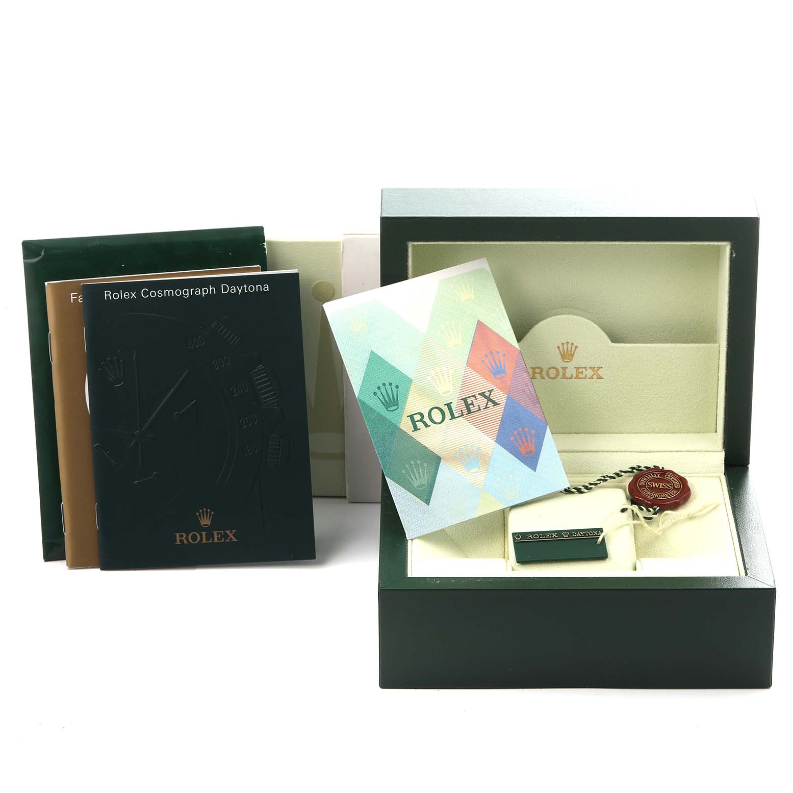 The image shows the packaging, booklets, and tags for a Rolex Daytona 116520 Men's Stainless Steel Black Dial 116520 Men's Stainless Steel Black Dial watch.