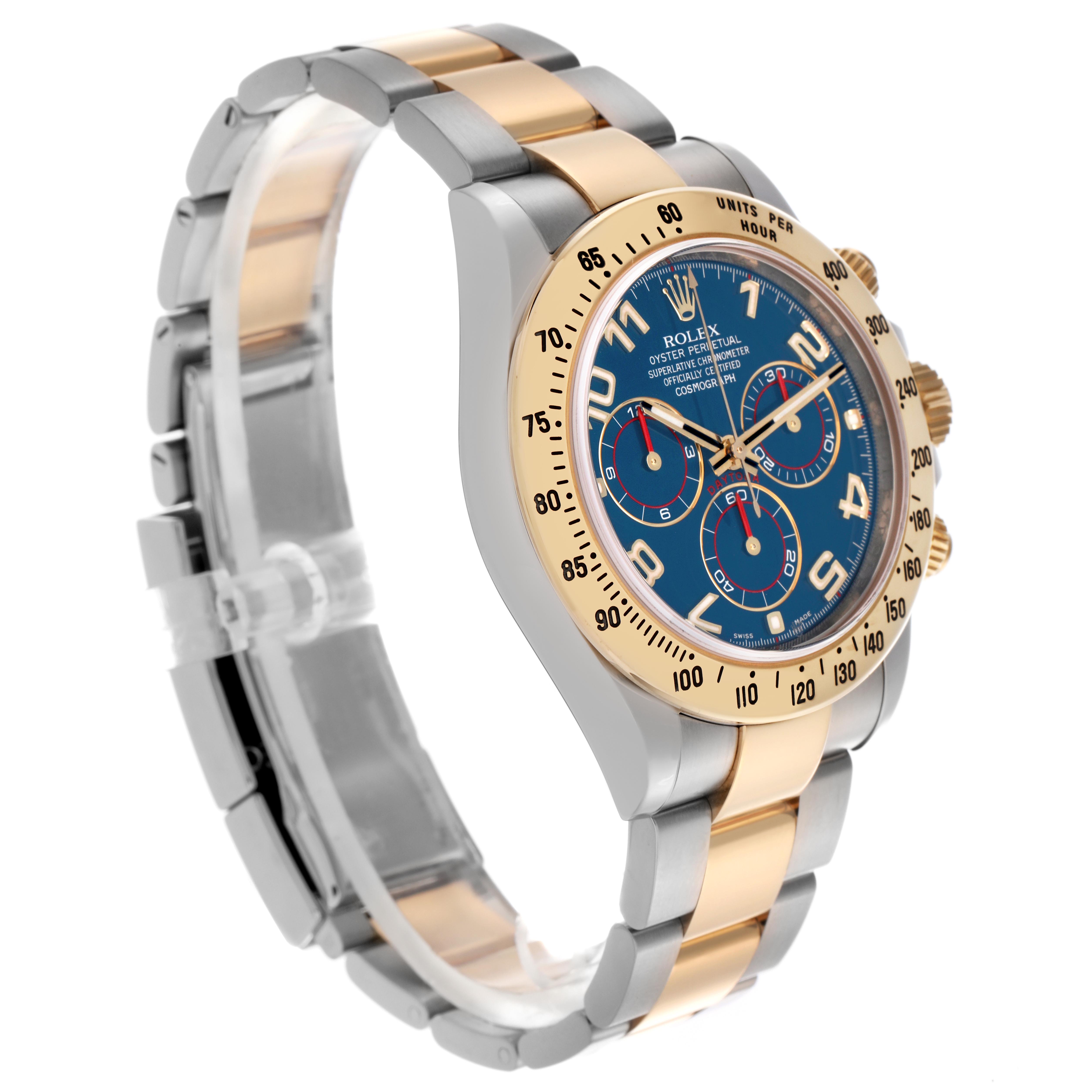 The image shows a side angle of the Rolex Daytona 116523 Men's Steel and Gold (two tone) Blue Dial 116523 Men's Steel and Gold (two tone) Blue Dial watch, highlighting the bezel, dial, pushers, and bracelet.
