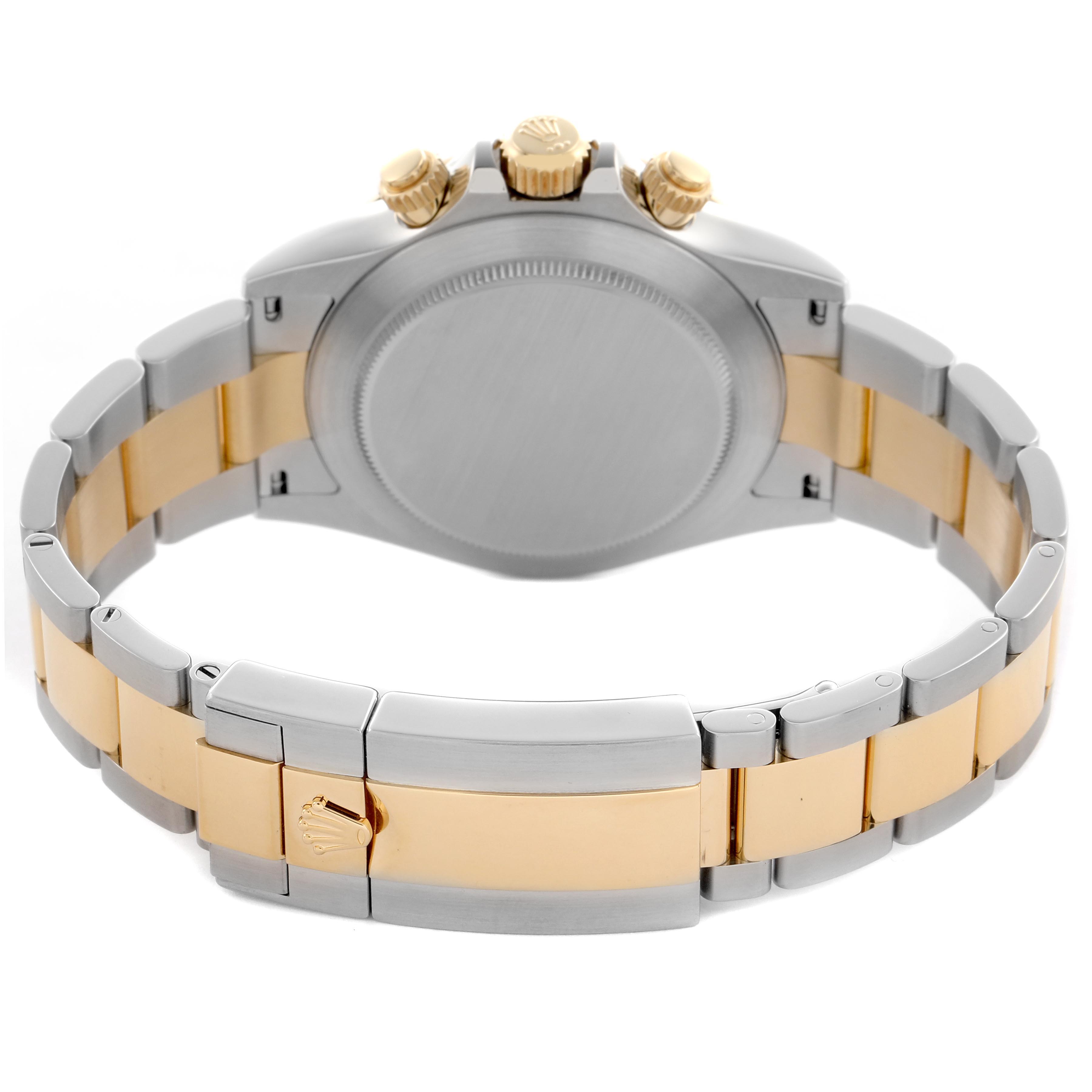 The image shows the back view of a Rolex Daytona 116523 Men's Steel and Gold (two tone) Blue Dial 116523 Men's Steel and Gold (two tone) Blue Dial, highlighting the two-tone bracelet, clasp, case back, and crowns.