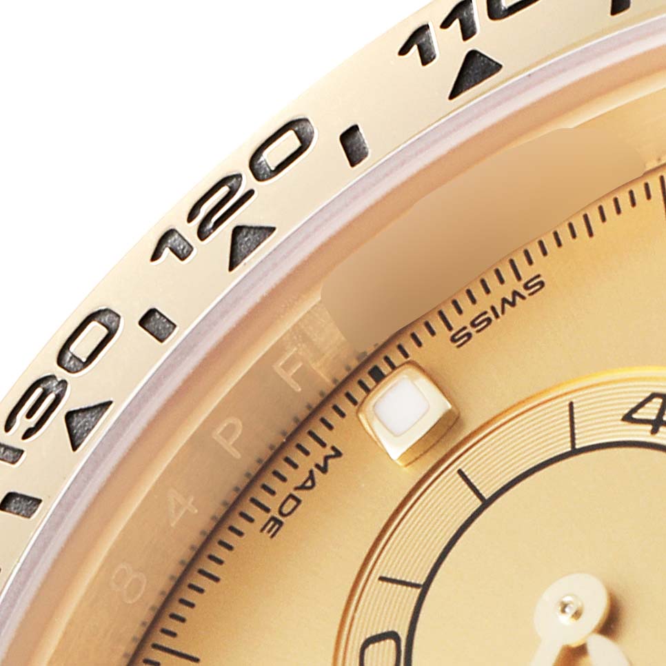 This image shows a close-up of the bezel and part of the dial of the Rolex Daytona 116508 Men's Yellow Gold Champagne Dial 116508 Men's Yellow Gold Champagne Dial watch.