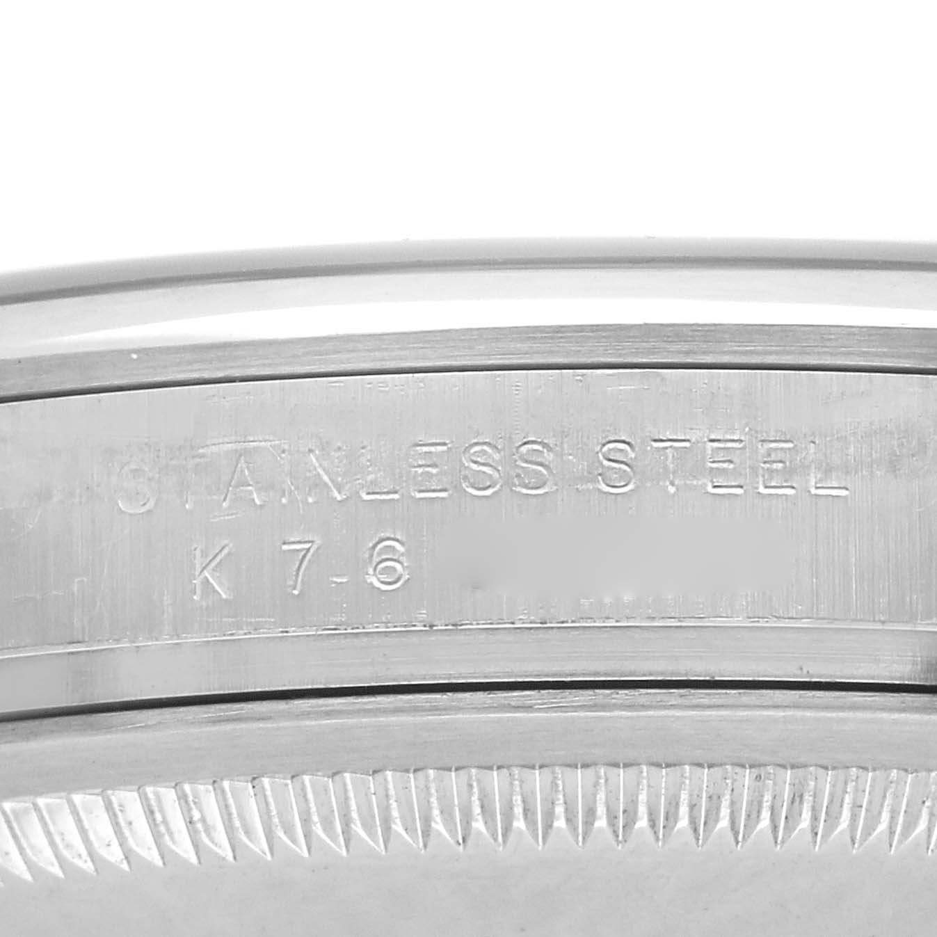 The image shows a close-up of the case of a Rolex Explorer 114270 Men's Stainless Steel Black Dial 114270 Men's Stainless Steel Black Dial, highlighting "STAINLESS STEEL" text.