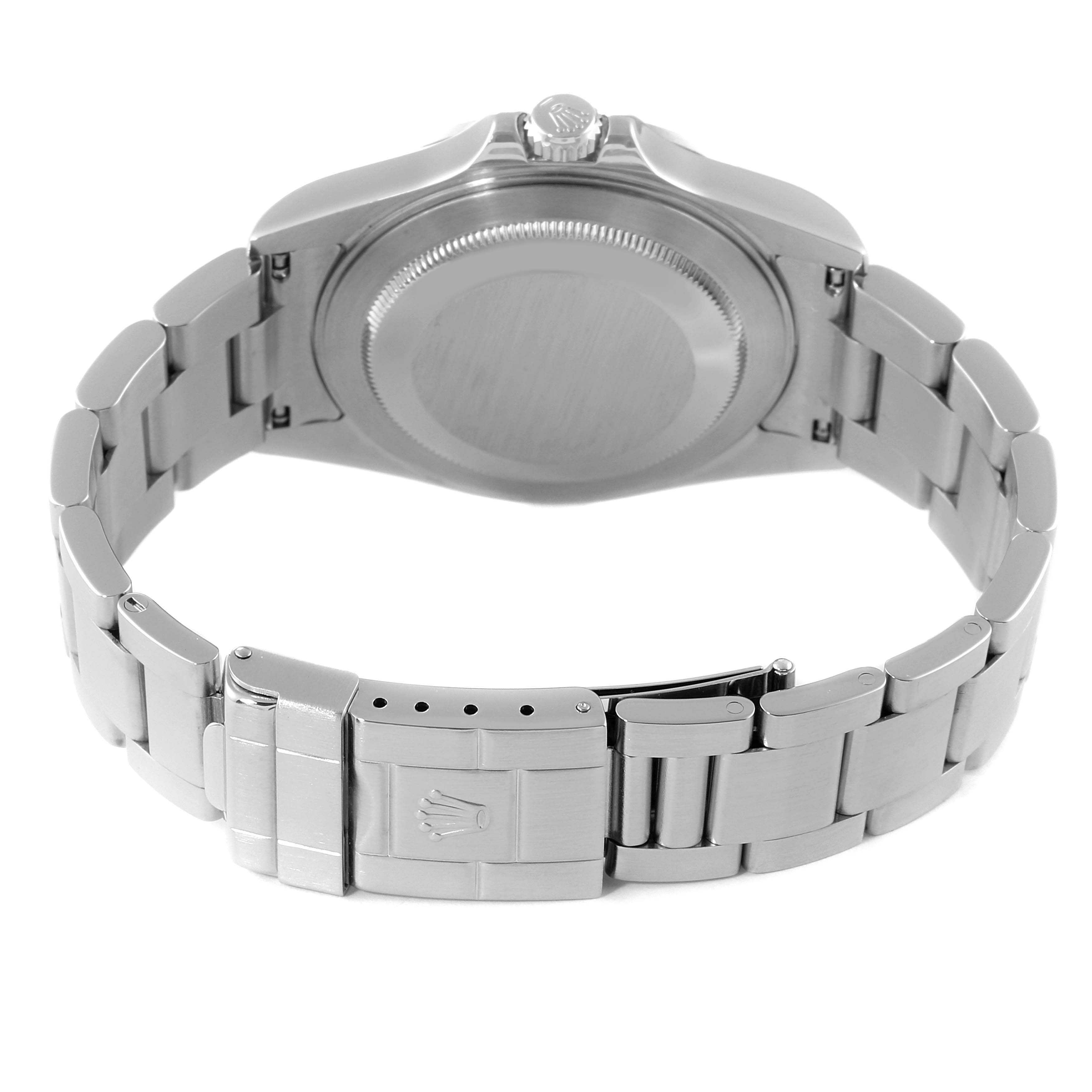 The image shows the back view of a Rolex Explorer 16570 Men
s Stainless Steel Black Dial 16570 Men
s Stainless Steel Black Dial watch, highlighting the closed clasp and stainless steel bracelet.