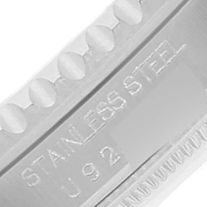 This image shows a close-up of the engraved "STAINLESS STEEL" marking on the bezel edge of a Rolex GMT-Master 16700 Men
s Stainless Steel Black Dial 16700 Men
s Stainless Steel Black Dial watch.