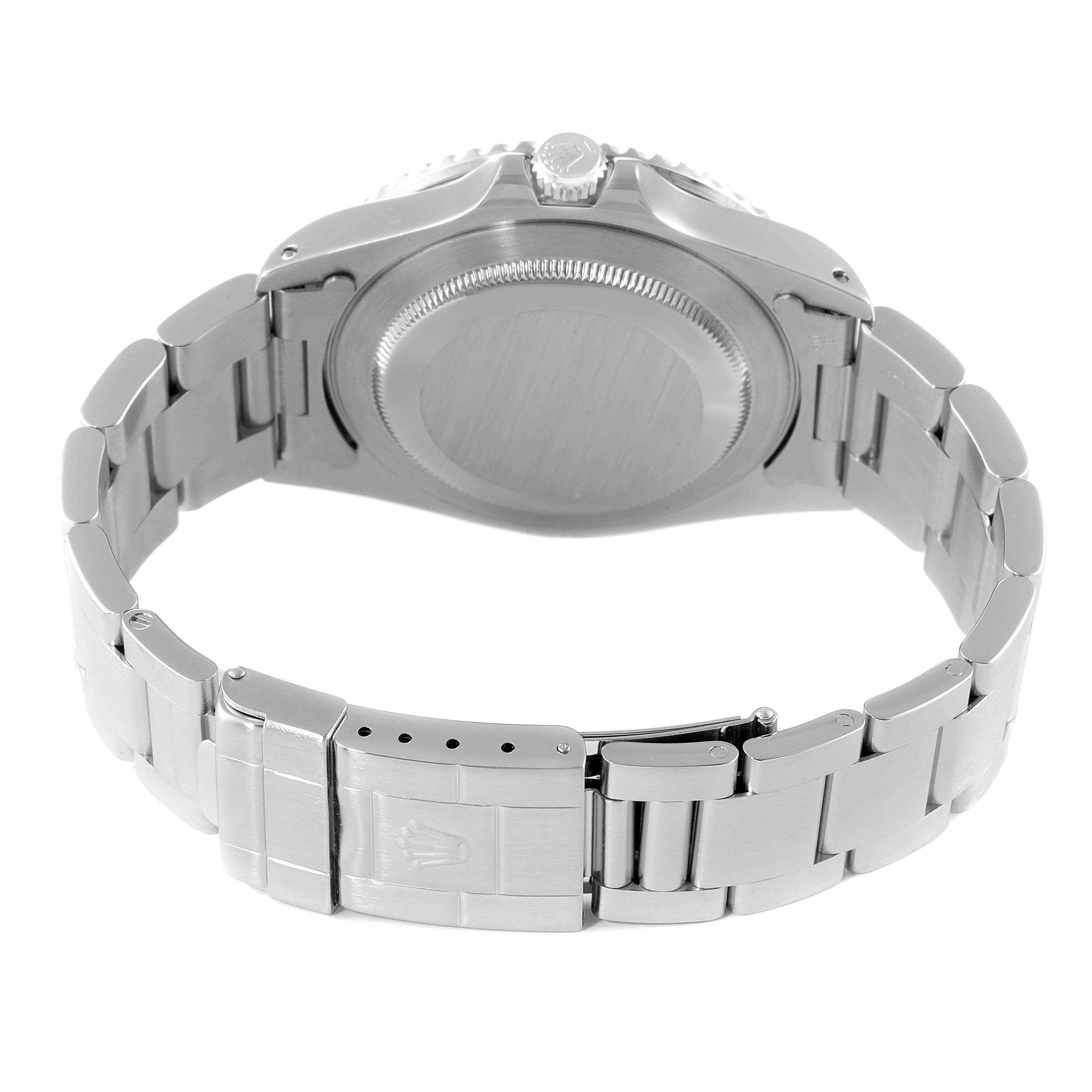 The image shows the back view and bracelet of a Rolex GMT-Master 16700 Men
s Stainless Steel Black Dial 16700 Men
s Stainless Steel Black Dial watch, emphasizing its clasp and case back.