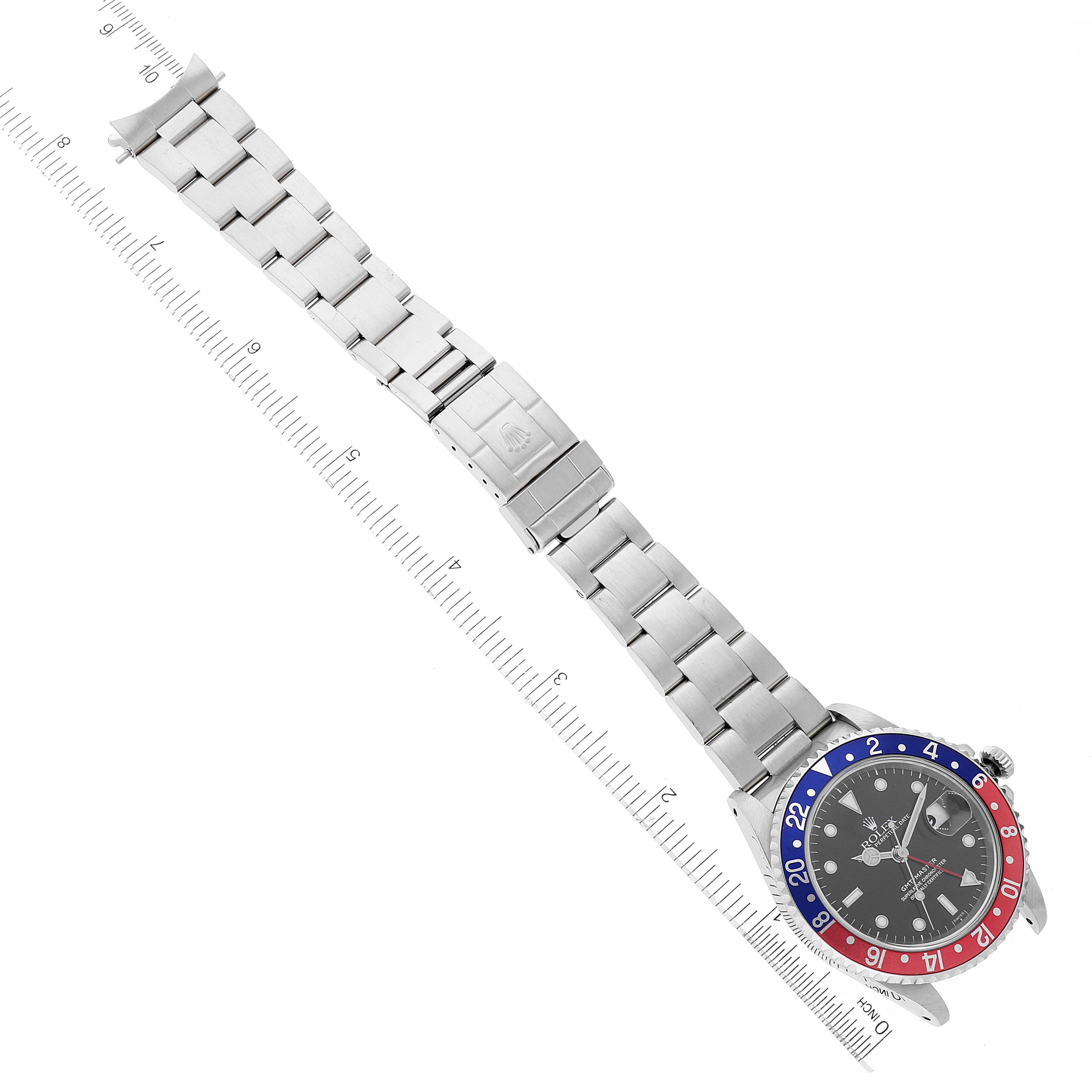 The Rolex GMT-Master 16700 Men
s Stainless Steel Black Dial 16700 Men
s Stainless Steel Black Dial watch is shown from a top-down angle, displaying the bracelet, clasp, and bezel with a bi-color scheme.