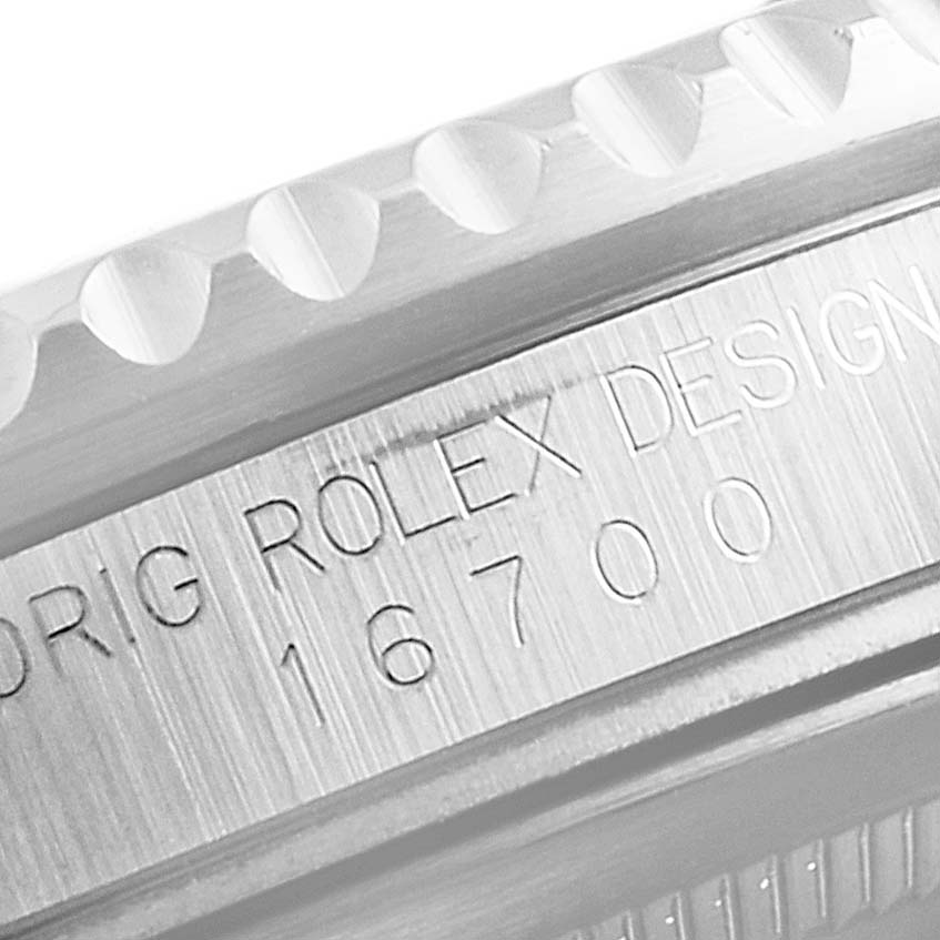 This is a close-up angle featuring the engraved 16700 model number along the case edge of the Rolex GMT-Master 16700 Men's Stainless Steel Black Dial 16700 Men's Stainless Steel Black Dial watch.