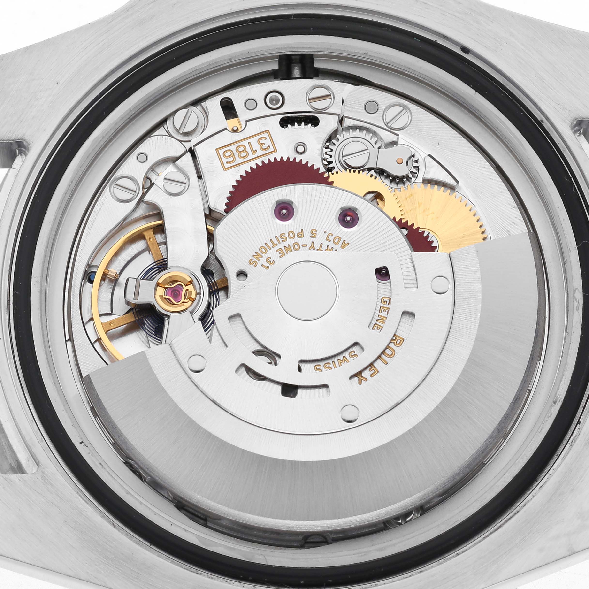 The image shows the movement mechanism of a Rolex GMT-Master 126710 Men's Stainless Steel Black Dial 126710 Men's Stainless Steel Black Dial, viewed from the back, highlighting gears and components.