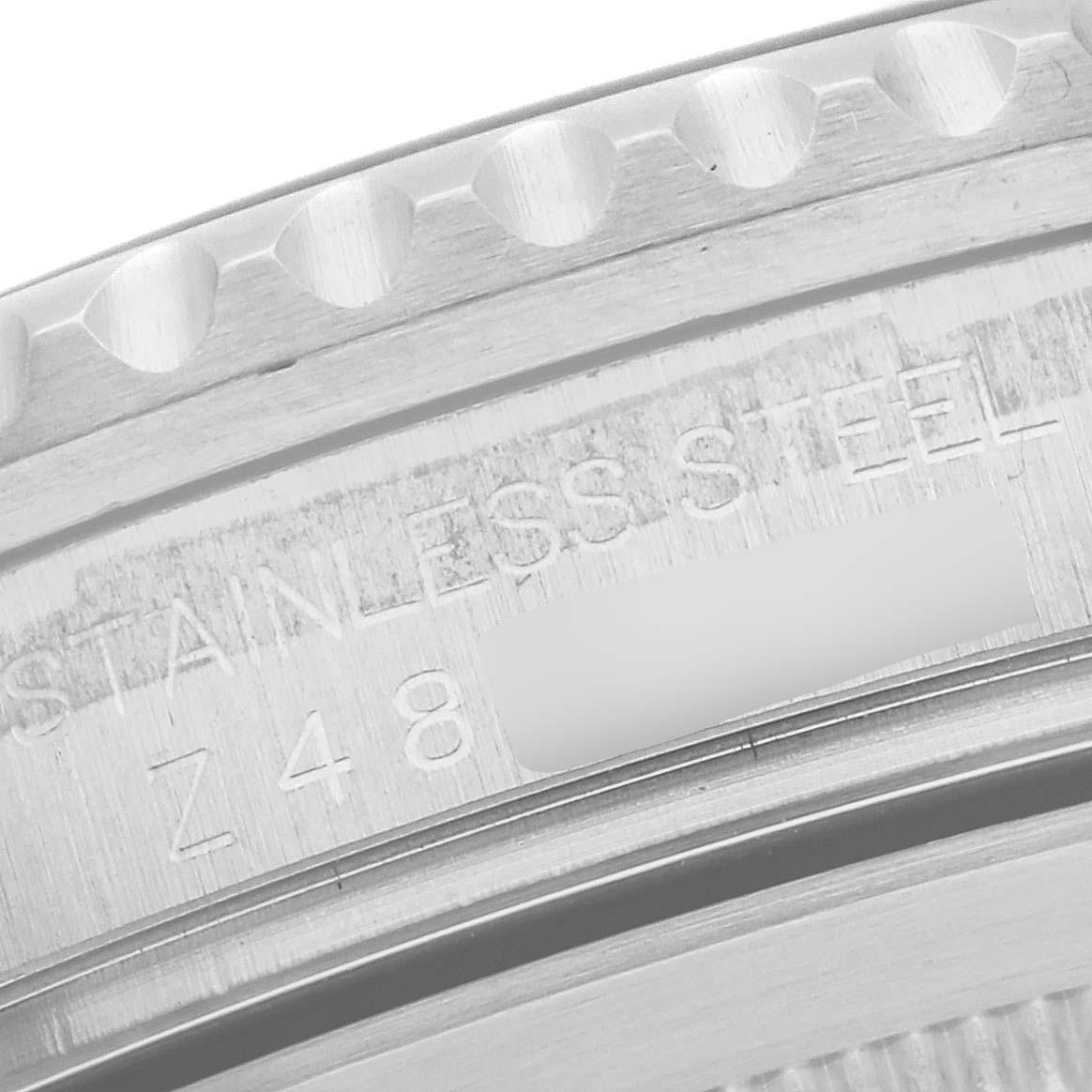 This image shows a close-up of the caseback of a Rolex GMT-Master 16710 Men's Stainless Steel Black Dial 16710 Men's Stainless Steel Black Dial watch, highlighting the markings.