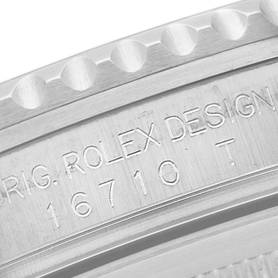 The image shows a close-up view of the case back of a Rolex GMT-Master 16710 Men's Stainless Steel Black Dial 16710 Men's Stainless Steel Black Dial, displaying the model number 16710 T and "ORIG. ROLEX DESIGN".