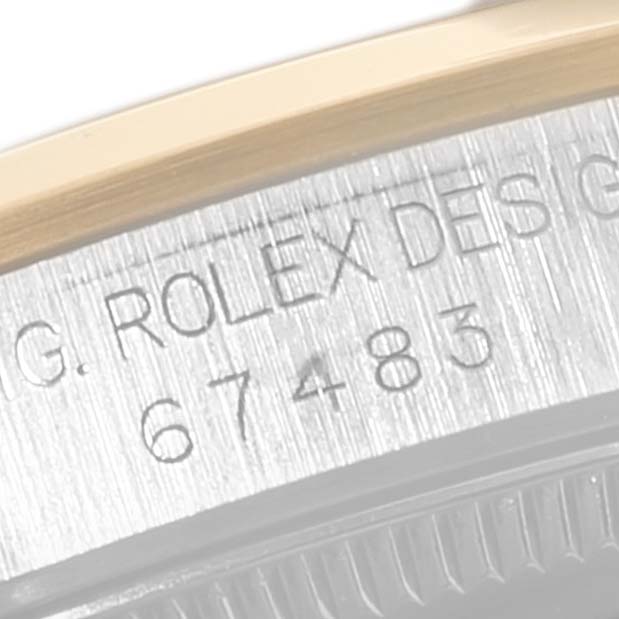 The image shows a close-up of the case back of a Mid-Size Rolex watch, revealing the model number and brand engraving.
