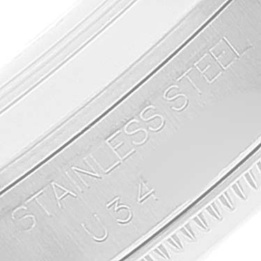 This image shows a close-up of the side of a stainless steel Rolex Mid-Size 68240 Women
s Stainless Steel Blue Dial 68240 Women
s Stainless Steel Blue Dial model, featuring the engravings "STAINLESS STEEL" and "U34."