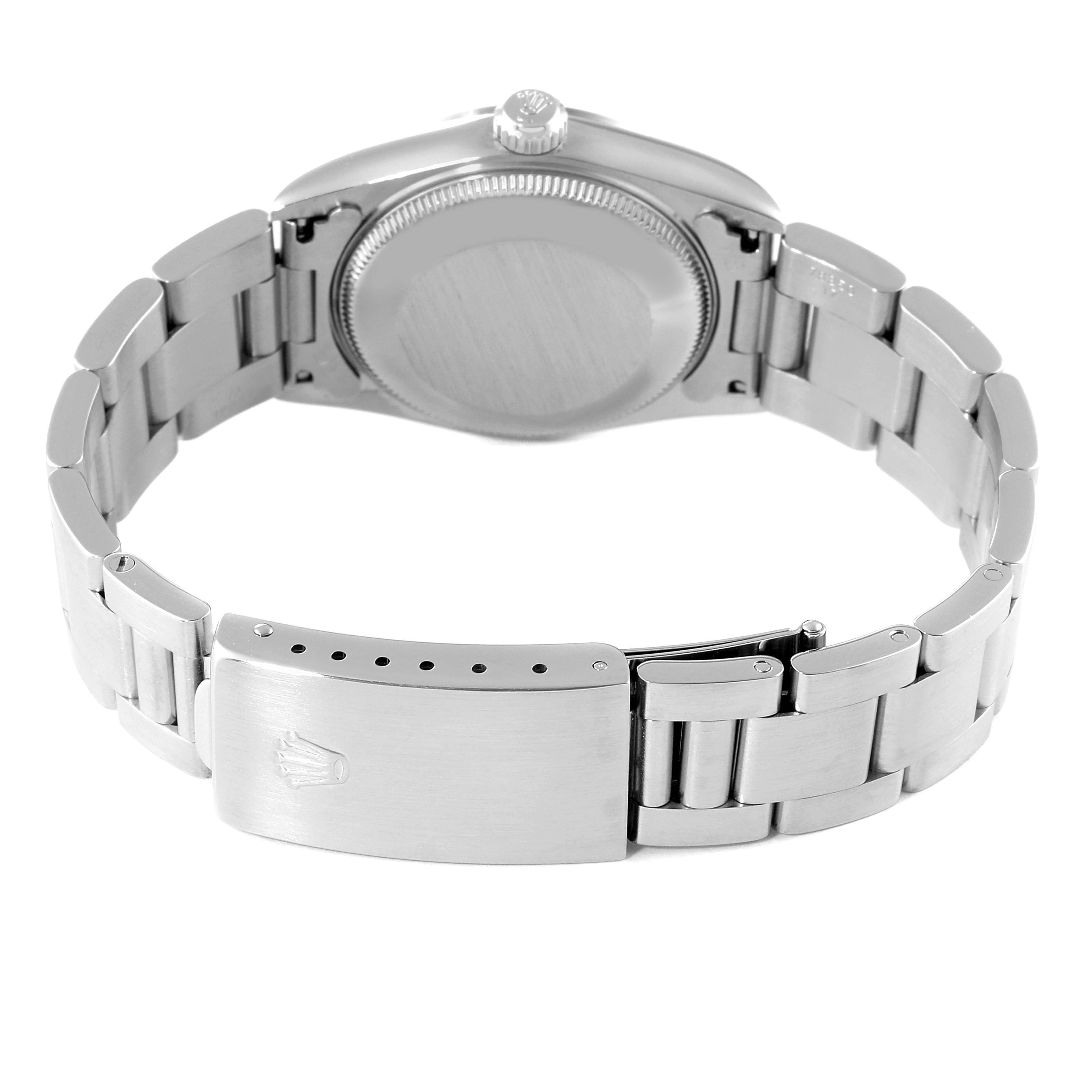 The image shows the back view of a Mid-Size Rolex watch, highlighting the case back and the metal bracelet with the clasp open.