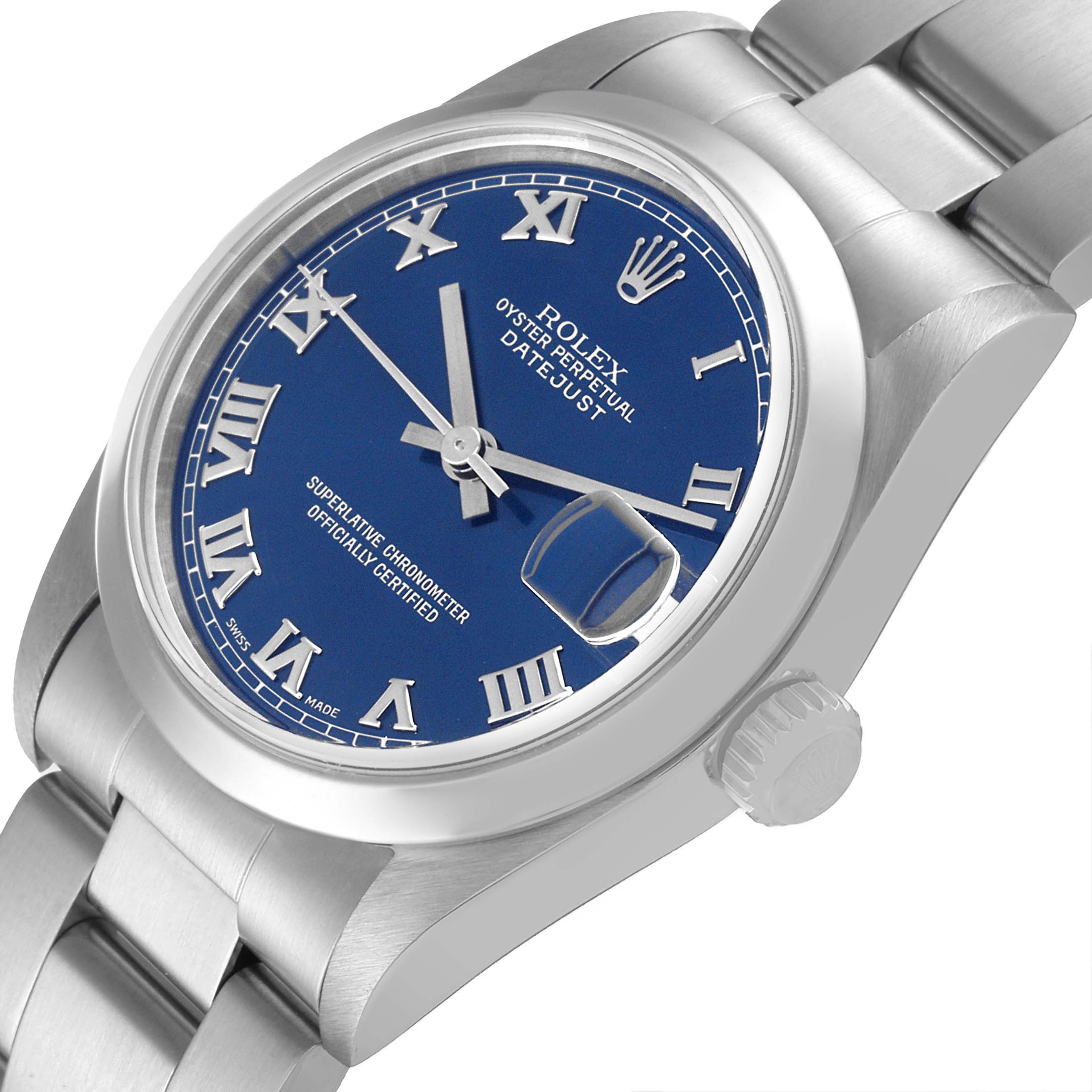 The image shows a Rolex Datejust Mid-Size watch from a 3/4 angle, highlighting the blue dial, Roman numerals, and stainless steel bracelet.