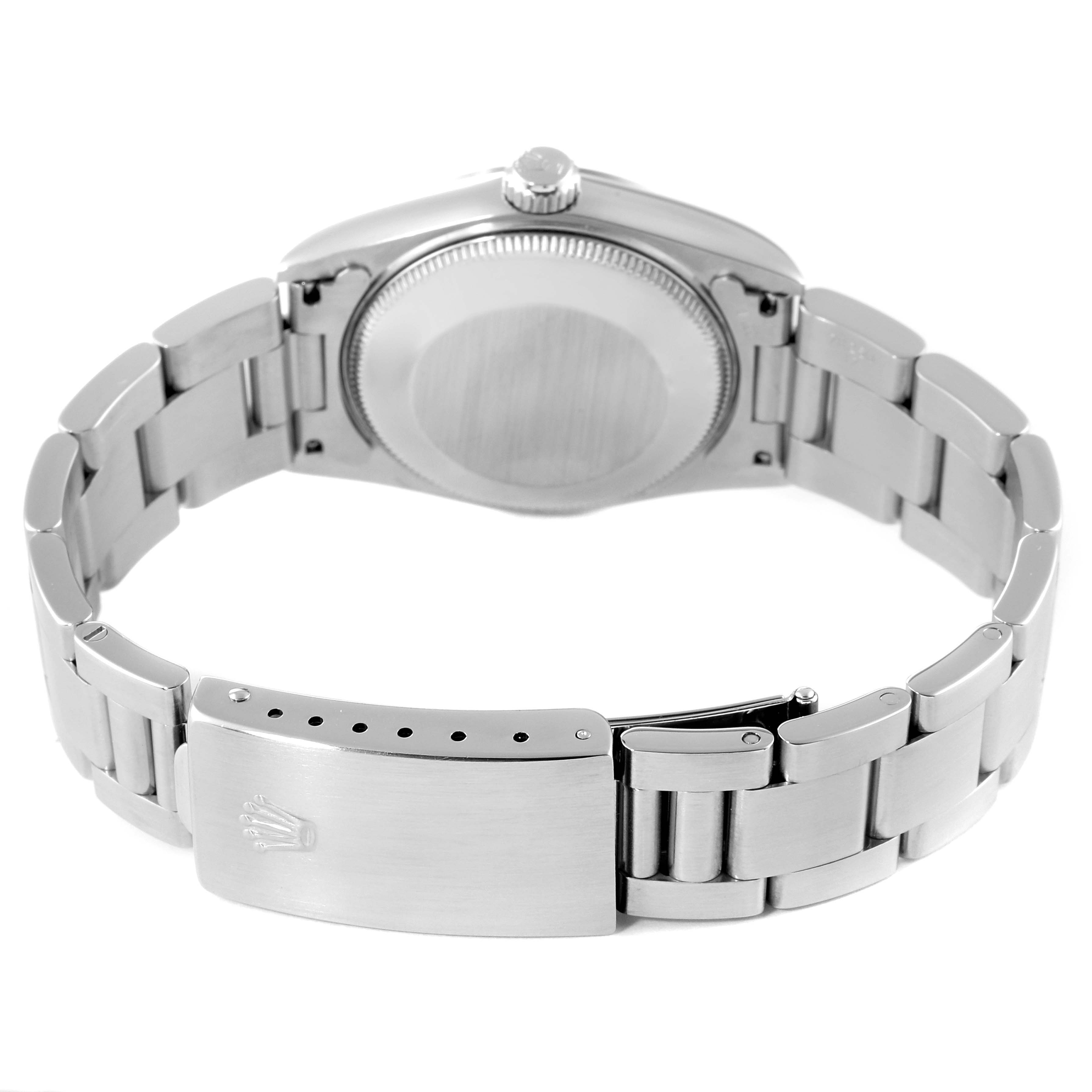 The image shows the back view of the Rolex Mid-Size 68240 Women
s Stainless Steel Blue Dial 68240 Women
s Stainless Steel Blue Dial watch, highlighting the case back and bracelet with the clasp.