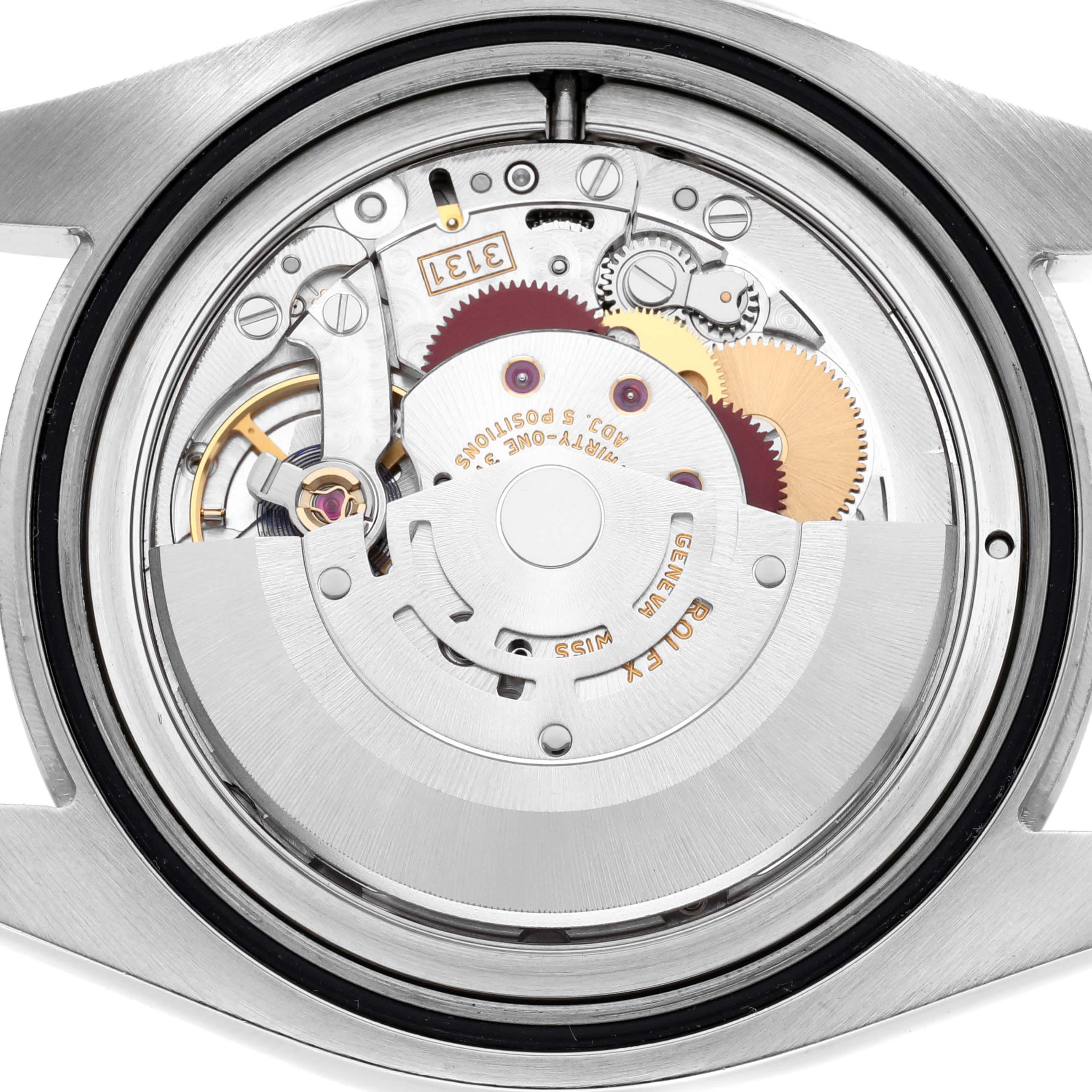 The image shows the internal movement of a Rolex Milgauss 116400 Men's Stainless Steel Black Dial 116400 Men's Stainless Steel Black Dial watch from a rear angle, highlighting its gears and rotor.