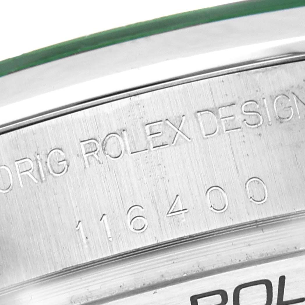 This image shows a close-up of the side of a Rolex Milgauss 116400 Men's Stainless Steel Black Dial 116400 Men's Stainless Steel Black Dial watch, focusing on engraved serial numbers and design details.