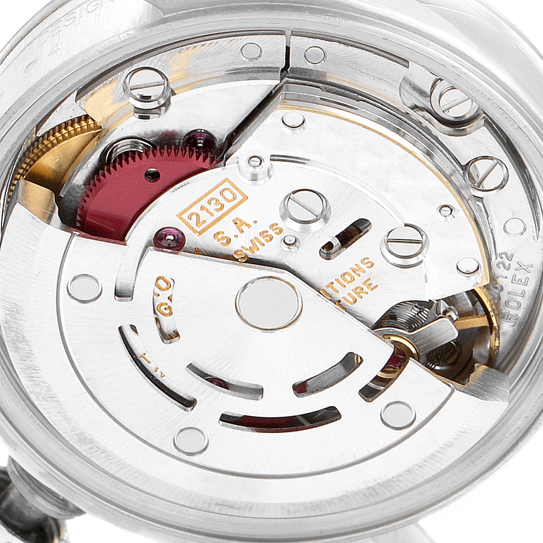 The image shows a close-up of the movement mechanism inside a Rolex Oyster Perpetual 67194 Women's Stainless Steel Black Dial 67194 Women's Stainless Steel Black Dial watch, focusing on the rotor and internal components.